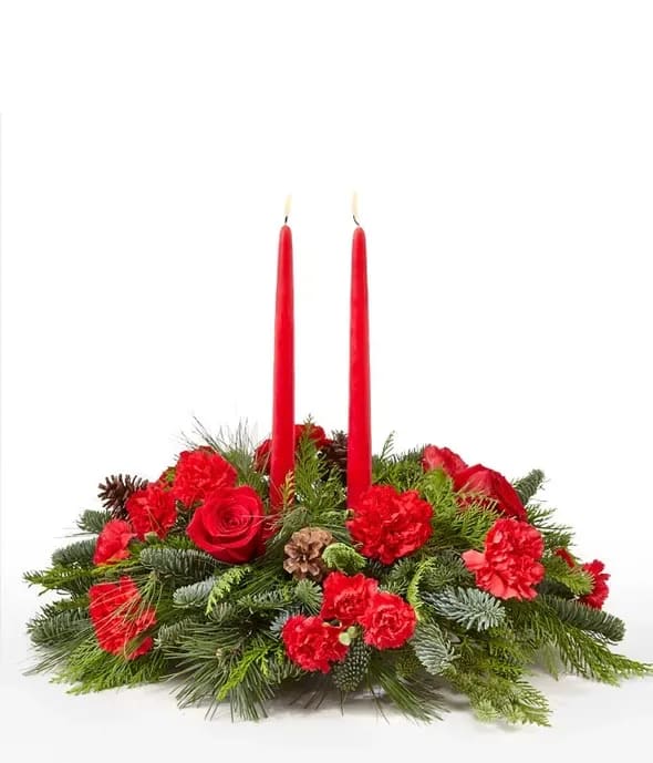 Holiday Shimmer Centerpiece - Make the season bright - and their table a delight - with the glowing tapers, radiant red roses and fresh Christmas greens of this stunning seasonal centerpiece.