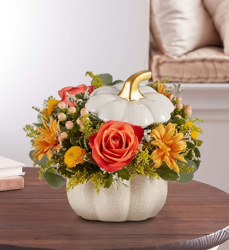 Plentiful White Pumpkin  - A plentiful mix of blooms gives our autumn arrangement an undeniable charm. Loosely gathered in cream and fall tones, it's the perfect contrast to our modern-styled pumpkin. Featuring a white satin finish, crackle detail and rich golden accent, this harvest-inspired container is perfect for repurposing.