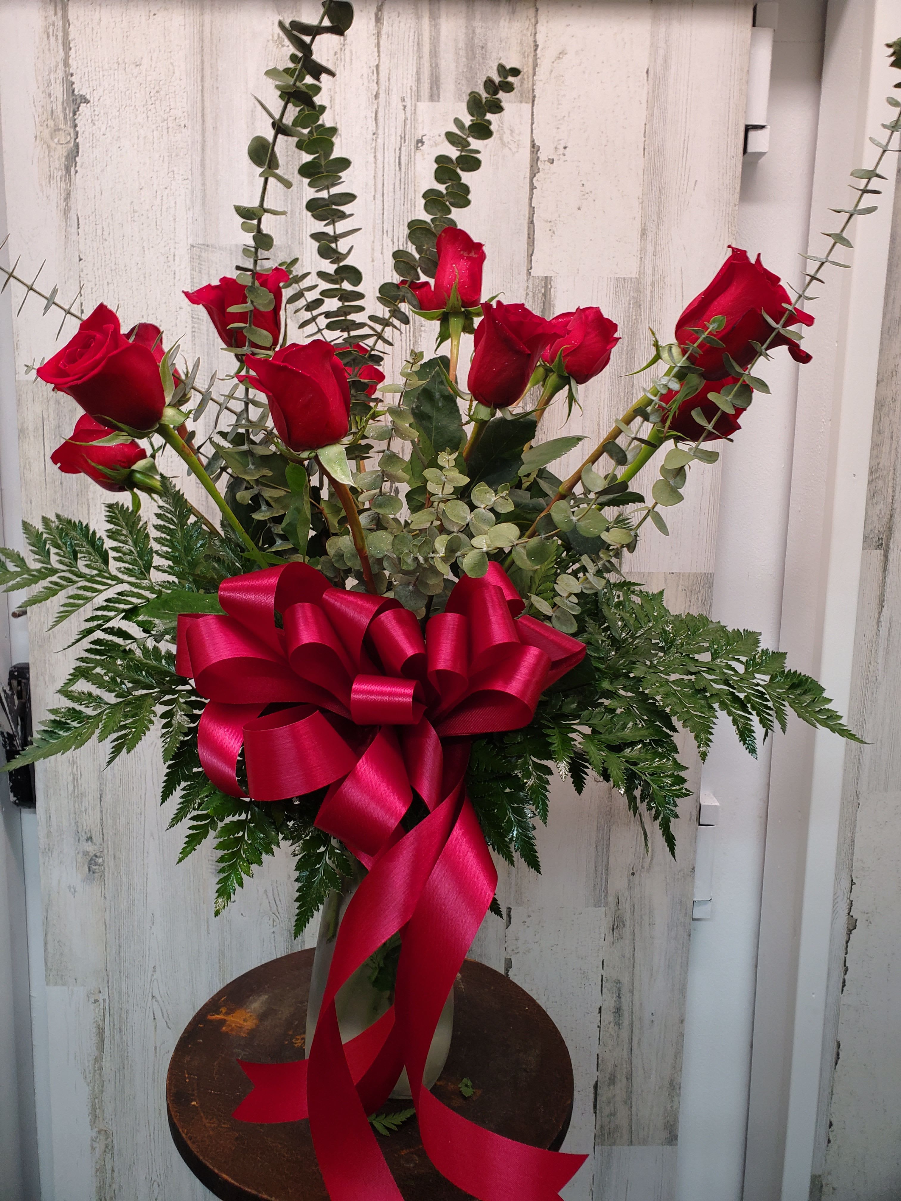 Juliet - A dozen red roses are always perfect, always savored. We add even more charming beauty with seeded eucalyptus, spiral eucalyptus and salal.