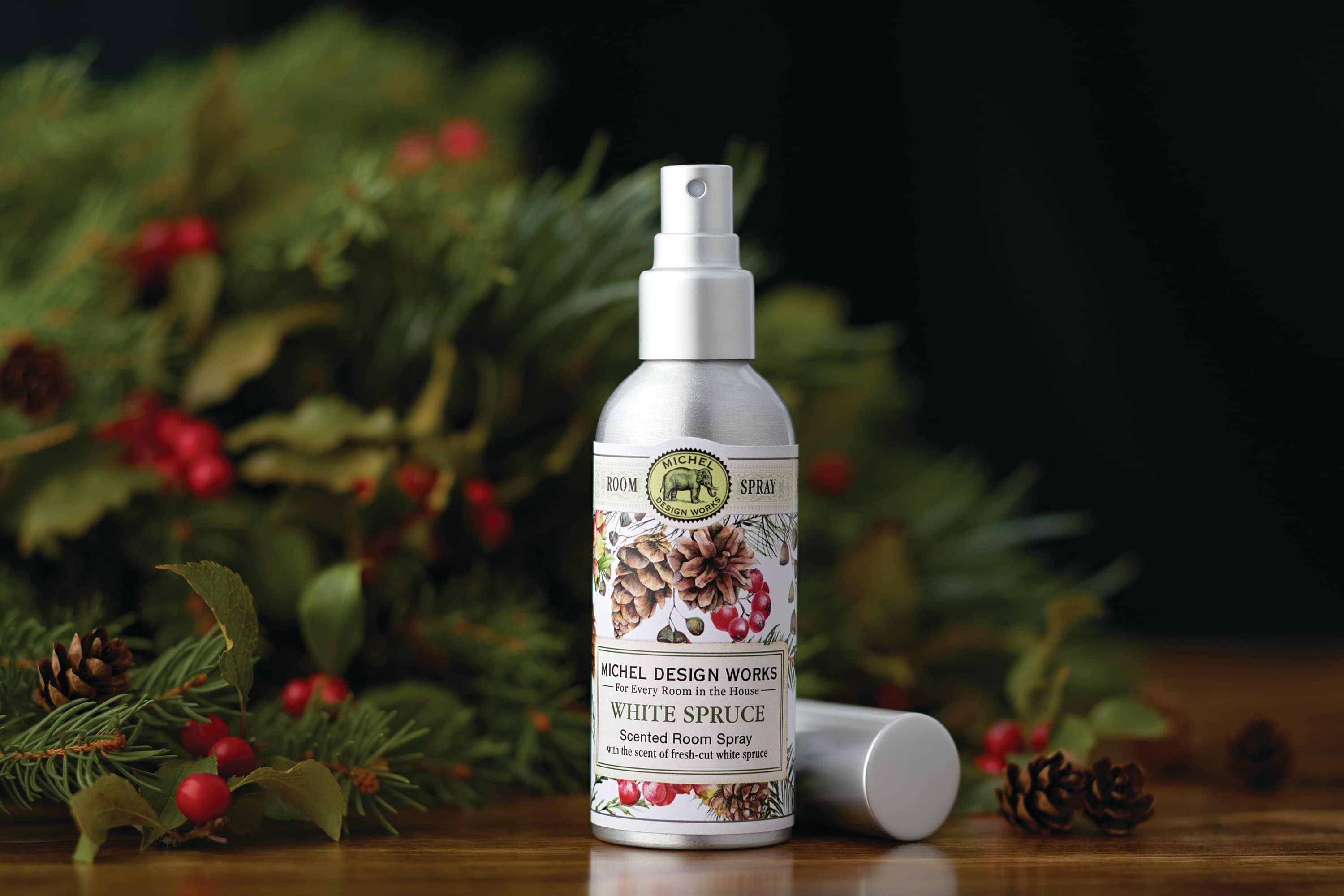 White Spruce Room Spray - Scent: True Spruce with touches of fruit and spice  Freshen up your room with the crisp scent of spruce. The design of greens, pine cones, and berries make for a perfect complement to any décor. To use simply spray air in a sweeping motion throughout the room. 3.4 fl oz/100ml 