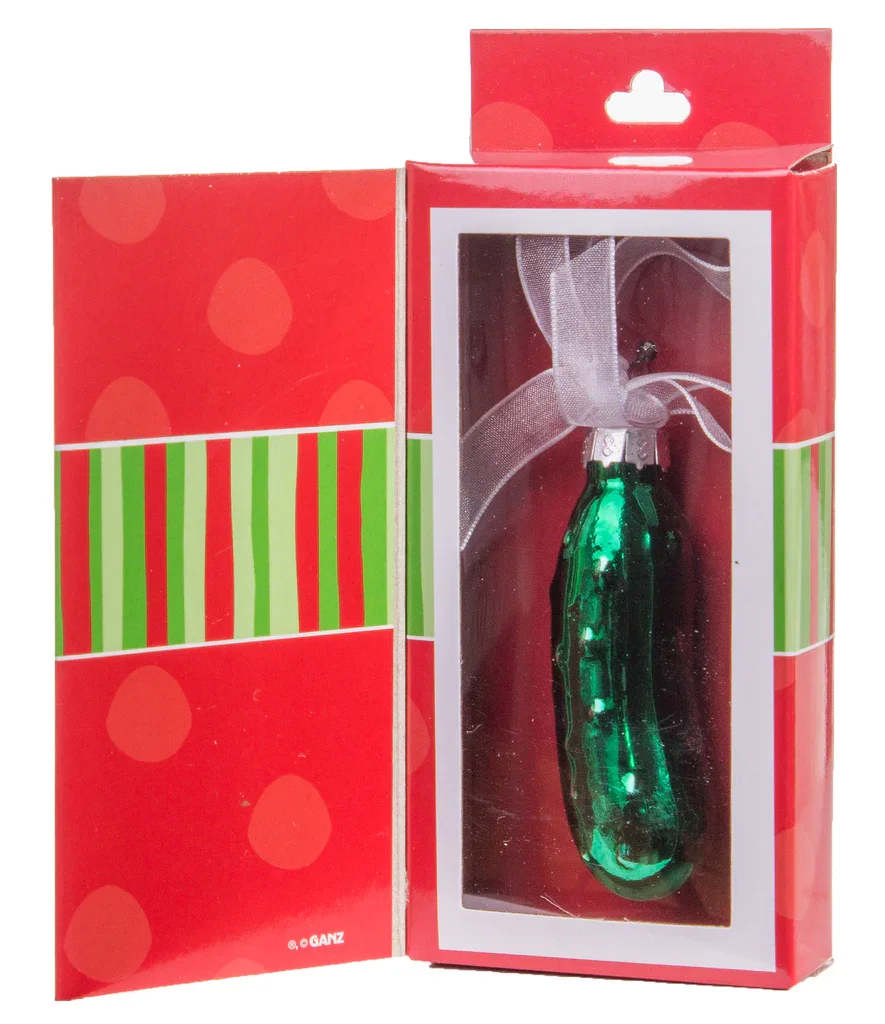Christmas Pickle Ornament - Celebrate Christmas tradition with this charming Pickle Ornament from Ganz, elegantly presented in a gift box. Crafted as a festive decoration, this ornament brings whimsical holiday cheer while continuing the beloved tradition of hiding a pickle ornament in the Christmas tree.  Ornament dimensions 2.5 inches length x 1inch wide