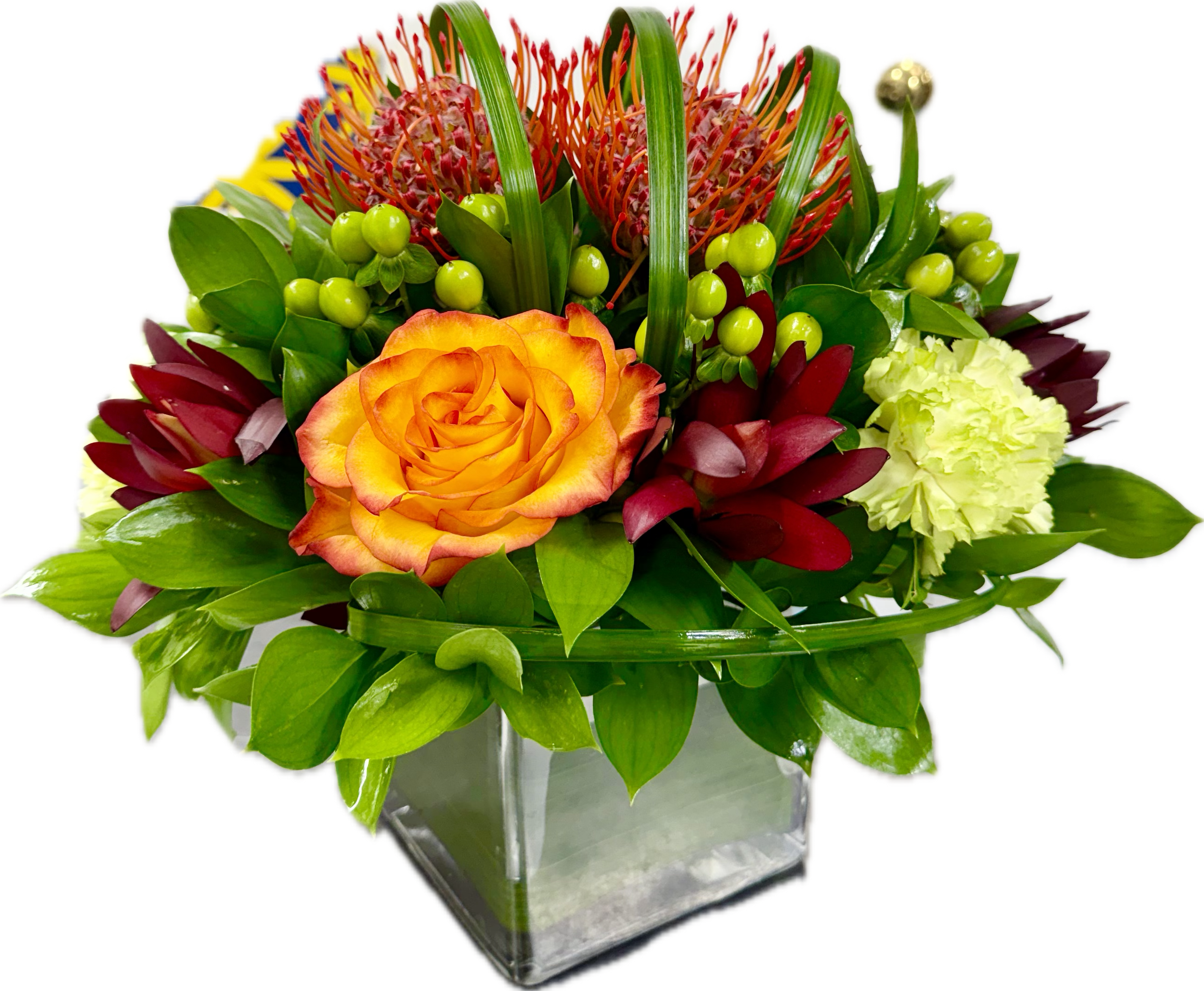 Tropical Sophistication Bouquet - The Tropical Sophistication bouquet is made with pincushions orange roses, green hypericum, green carnations, safari sunset flowers, on a crystal square vase covered with green TI leaf.