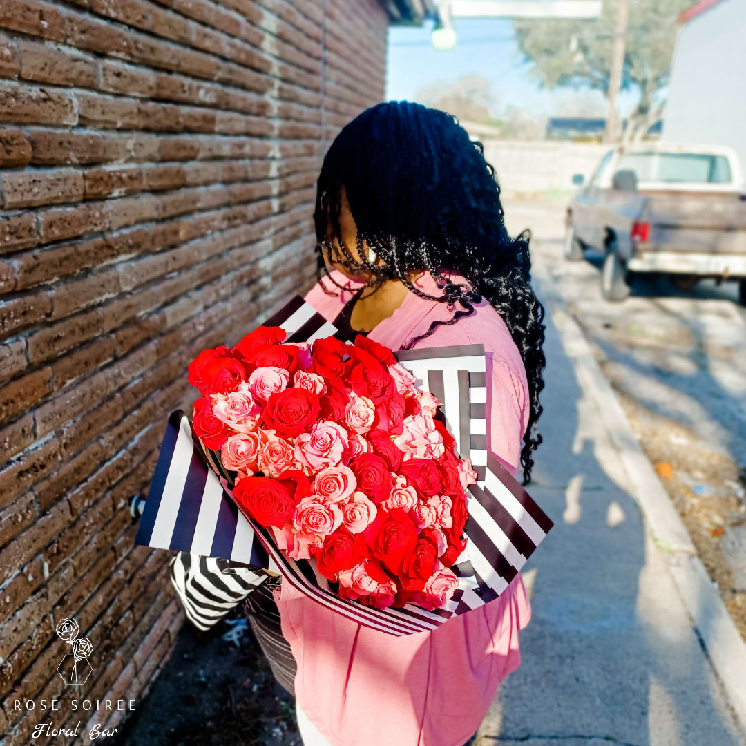 Huge Crush - Your love will swoon over this enormous bouquet of 50 roses. Half  red, and half pink. Red roses are the true sign of love, symbolizing passion, desire and romance. While pink roses represent gratitude and admiration.