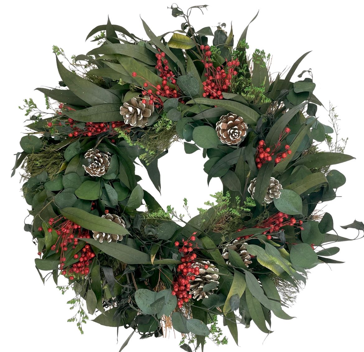 pinecone holiday wreath - A festive wreath that can both transition in and out of the holiday with its lush greenery, this wreath is made on an 18” twig base covered in gorgeous silver dollar and willow eucalyptus leaves and accentuated with white tipped pinecones, delicate floral stems and red berries to fill the wreath out. 