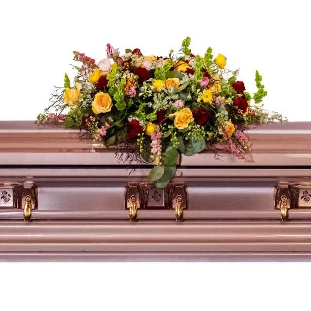 Garden of Memories Casket Spray - Celebrate a beautiful life with this deep array of fresh blooms.