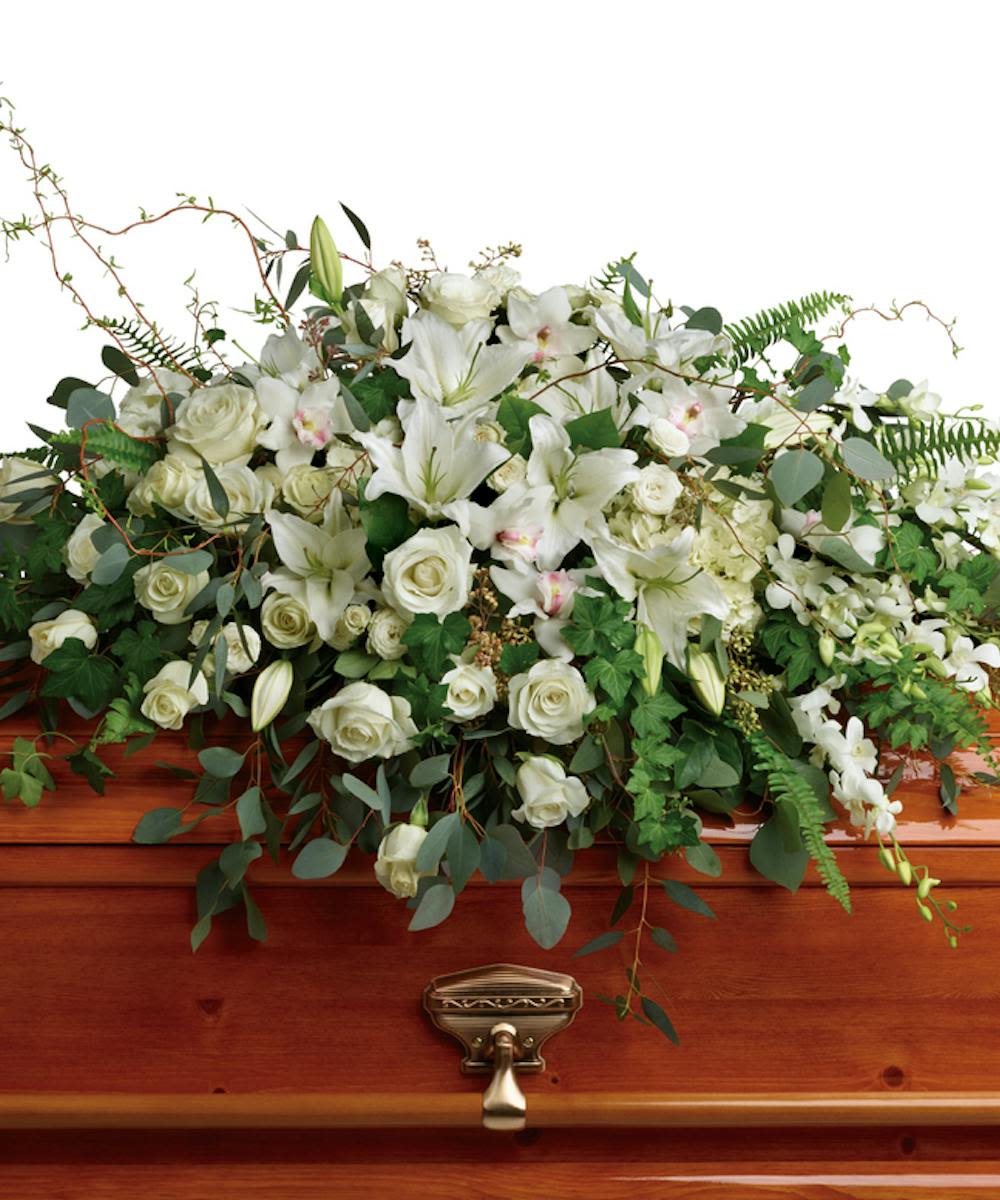 Grandest Glory Casket Spray - A classic and graceful tribute, this casket spray is composed of elegant white blooms.