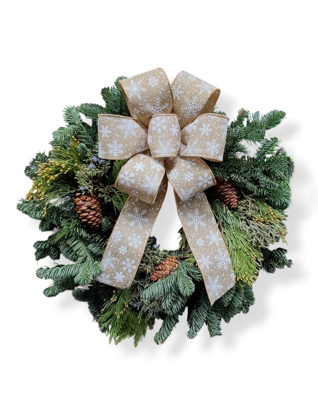 Snow Place like Home - This beautiful wreath has pinecones and big bow with printed snowflakes.