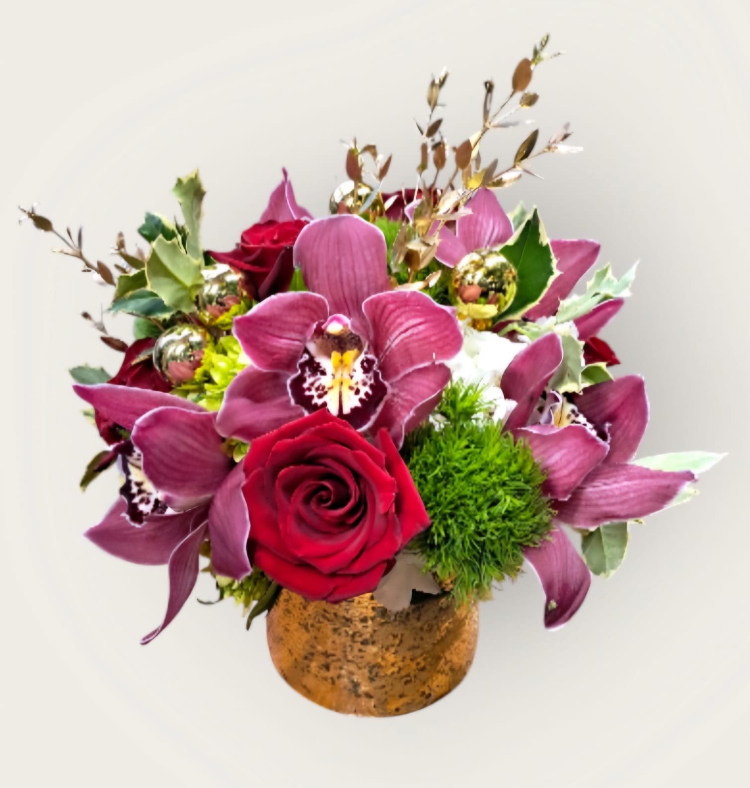 Holiday Cheers  - This arrangement has cymbidium orchids, red roses, green hydrangeas, and dianthus in a gold vase. 