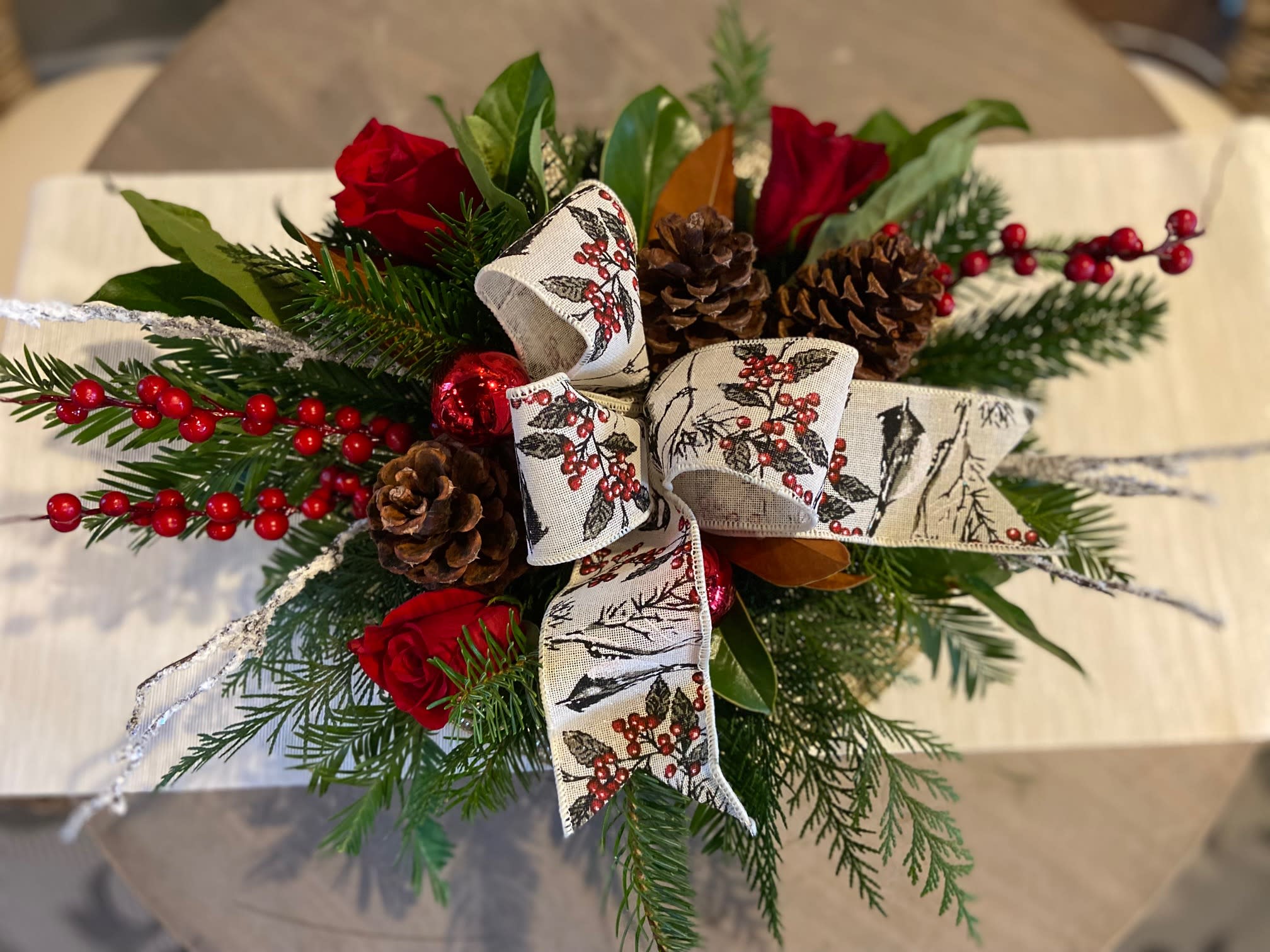 Elegant Simplicity Centerpiece - Delightfully Simple Centerpiece with Red Berries and Classic Ribbon.  *Ribbon print my vary.