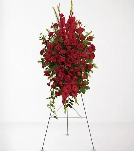 Forever in Our Hearts - Express your heartfelt sympathies by sending a magnificent spray of all-red floral favorites. It is a beautiful and vibrant way to help ease the pain of loss.