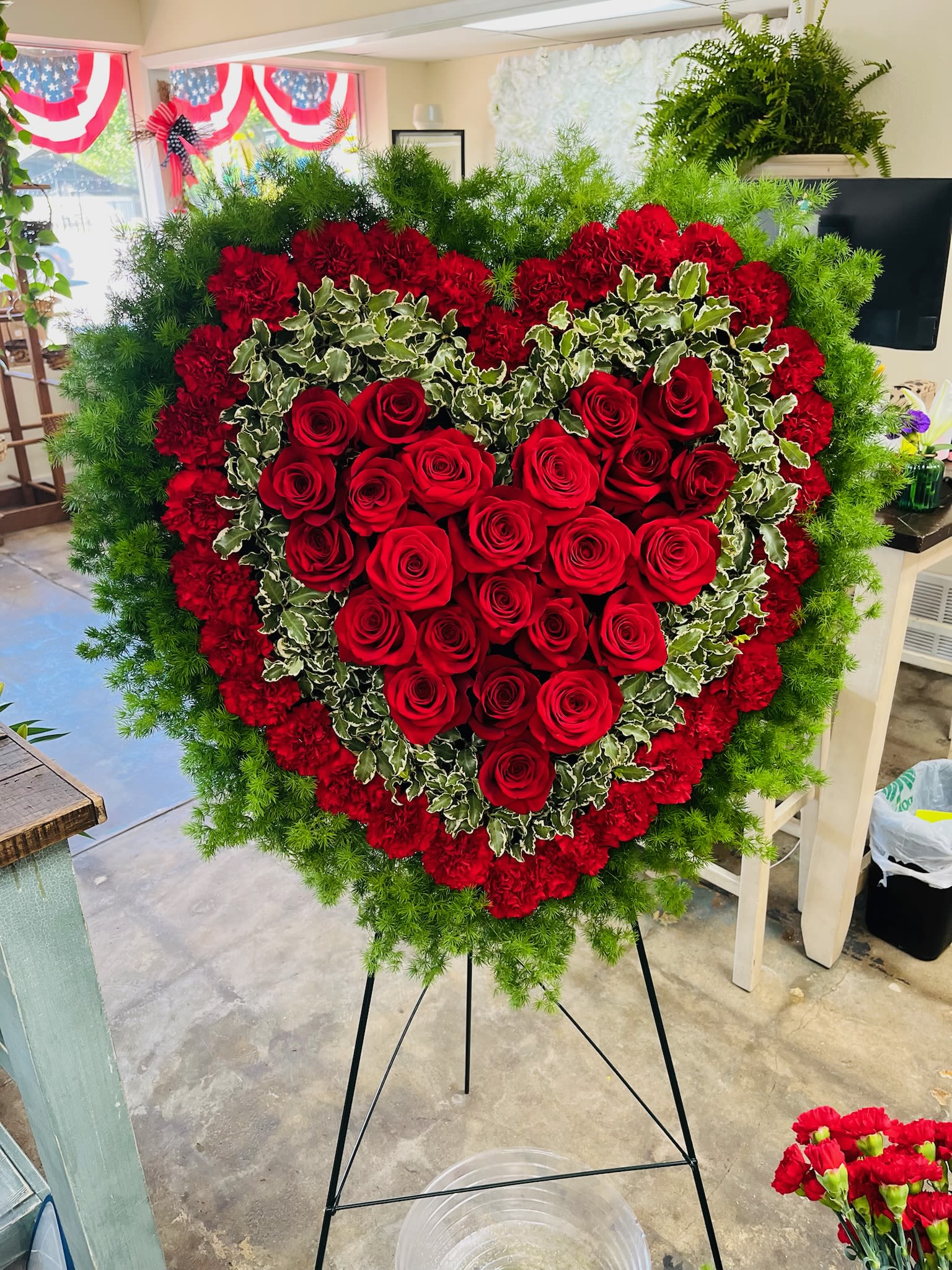 Full Heart Easel - Full Heart Easel Display is a striking symbol of enduring love and compassion. Beautifully crafted with fresh roses in the shape of a 18 inch full heart.