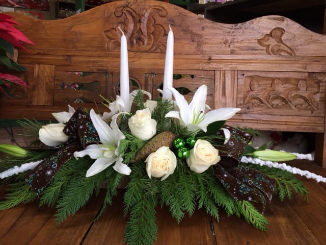 Winter Dreams Arrangement - White roses and lilies with winter greens.