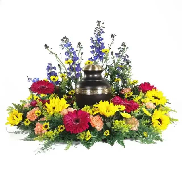 Vibrant Memories Urn Wreath - Rich with vibrant color and natural texture, this wreath offers a bold and respectful tribute. Crafted with warm, earthy tones and deep accents, it honors a life lived with strength, character, and enduring impact.
