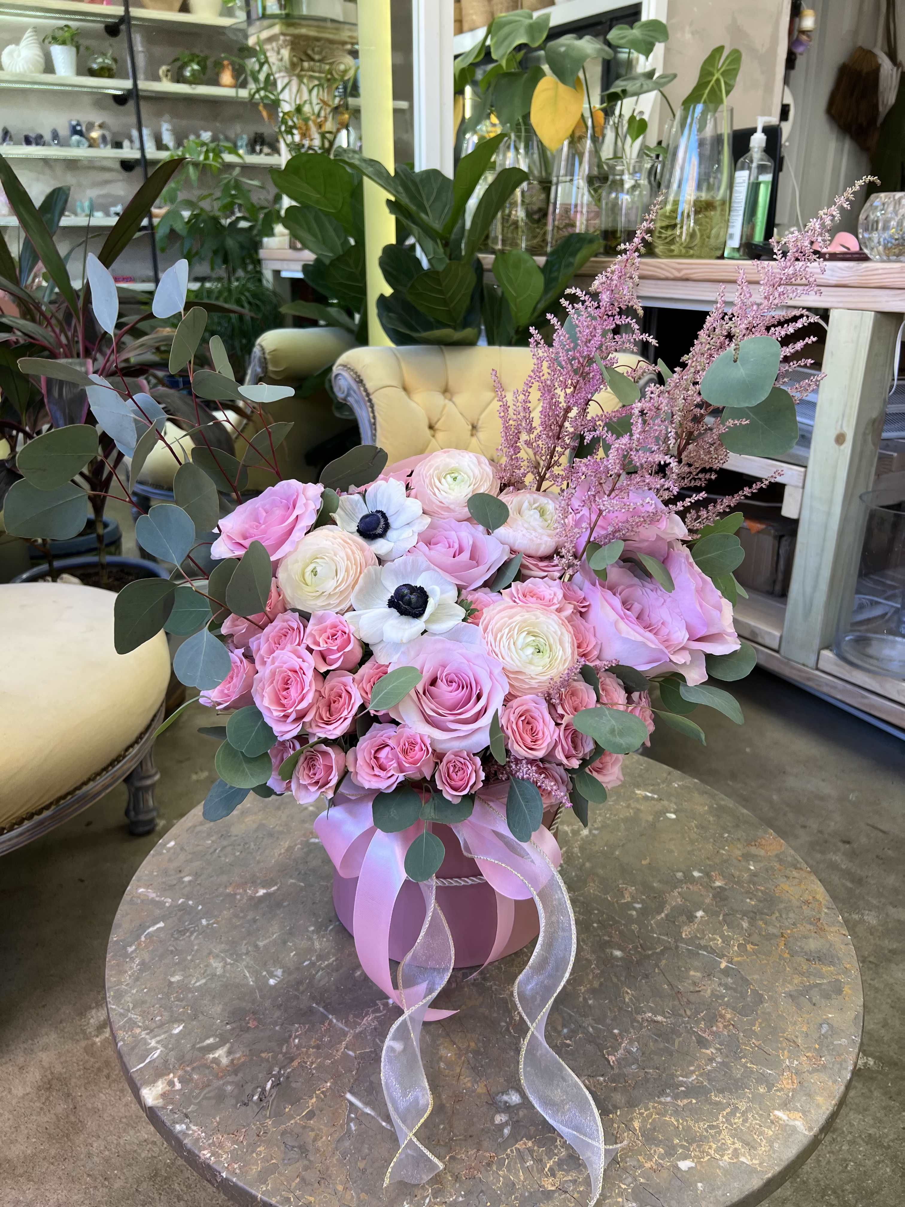 Pretty In Pink  - Love in Full Bloom!  A garden of pink roses, ranunculus, and anemones wrapped in soft textures. This arrangement was made to celebrate life's sweetest moments.  Perfect for baby shower's, birthday's, or a little self-love. 