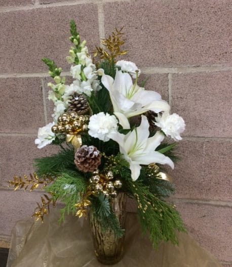 Let it Snow - White lilies, carnations and roses with gold accents in a gold mercury glass vase. 