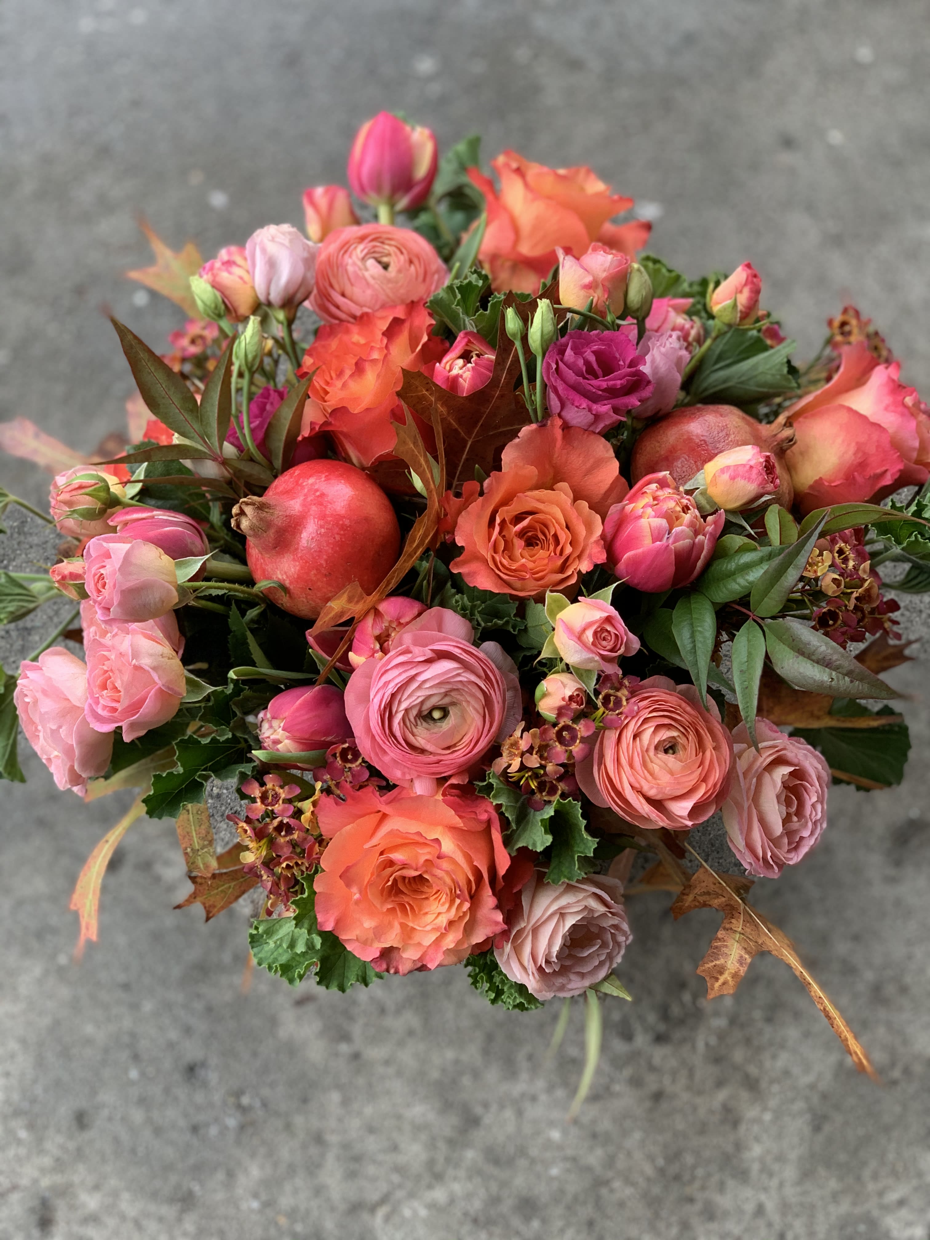 Thankful 1 - Pomegranate pinks, coral, orang, peaches  with touches of fall foliage in a vase. vase. Elegant and impactful, this is a premium bloom bouquet that will delight the recipient. It is happy and people LOVE receiving this design. It really  brightens up a table.   NOTES: We will choose the freshest and most interesting ingredients at the market to make this arrangement shine. Vessel may be substituted depending on availability.  ***Thanksgiving week orders will go out between 12-5pm 11/25--11/26 **  If any design element such as color or flower/foliage are very important to your order please contact us to ensure availability first by calling the shop at  415 751 2747 