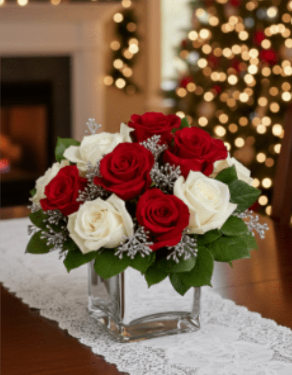  Snowy Night - Go contemporary this Christmas with a trendy mirrored cube filled with lush red and white roses. This exciting bouquet offers an affordable way to make a huge impression on your host or hostess. They'll love the gift - you'll love the welcome.