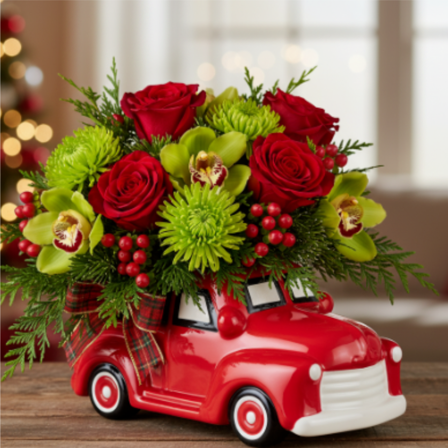 Santa's Little Pickup - This adorable ceramic red pickup truck is hauling nothing but holiday cheer! We've loaded the bed with a vibrant mix of bright red roses, happy green mums, and exotic green cymbidium orchids. Fluffy evergreen sprigs and tiny red berries add the perfect festive touch, tied up with a cute plaid ribbon. It's the most precious delivery of the season and a keepsake that will make everyone smile!