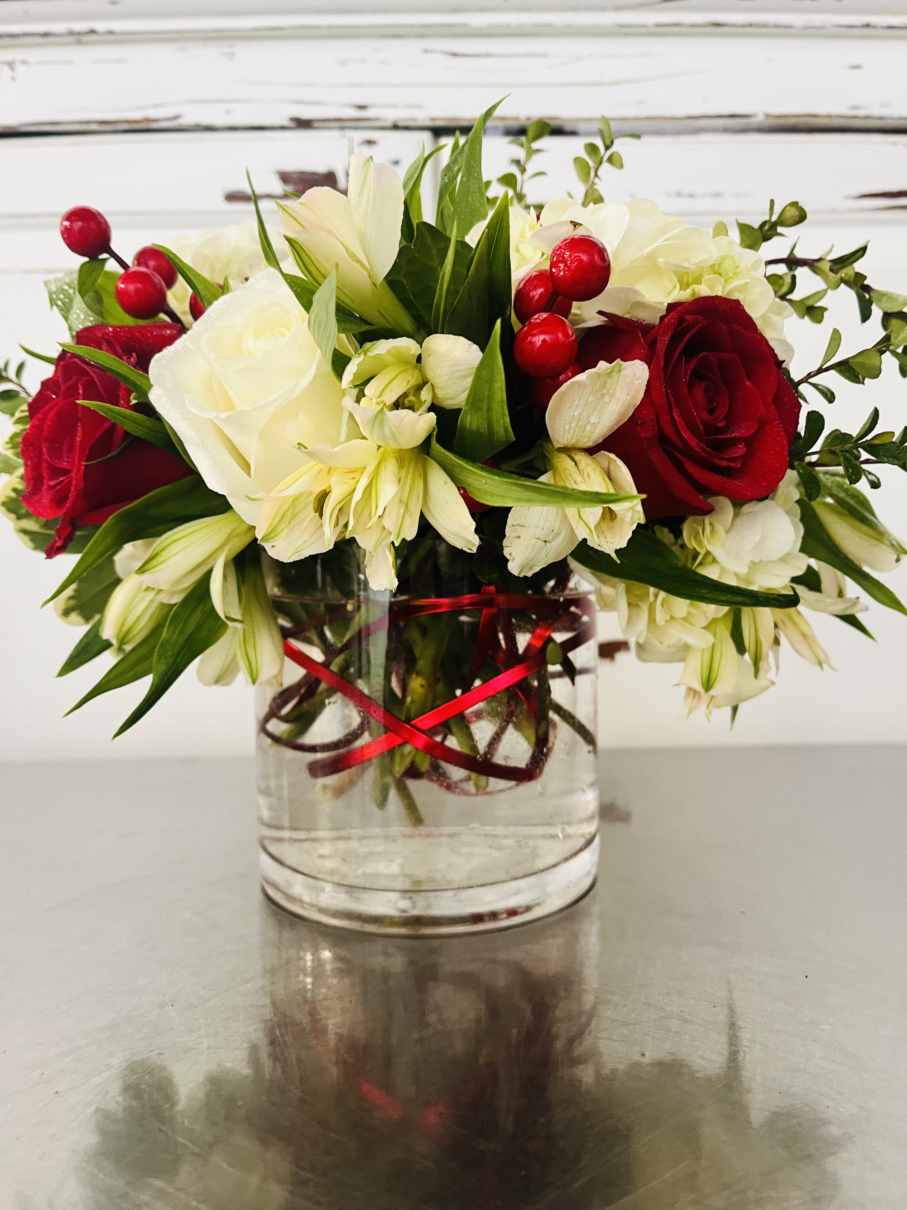 Christmas Jazz - This festive Red and White Holiday arrangement will bring good cheer to all. With the added flair of coiled, Red aluminum wire for added interest.