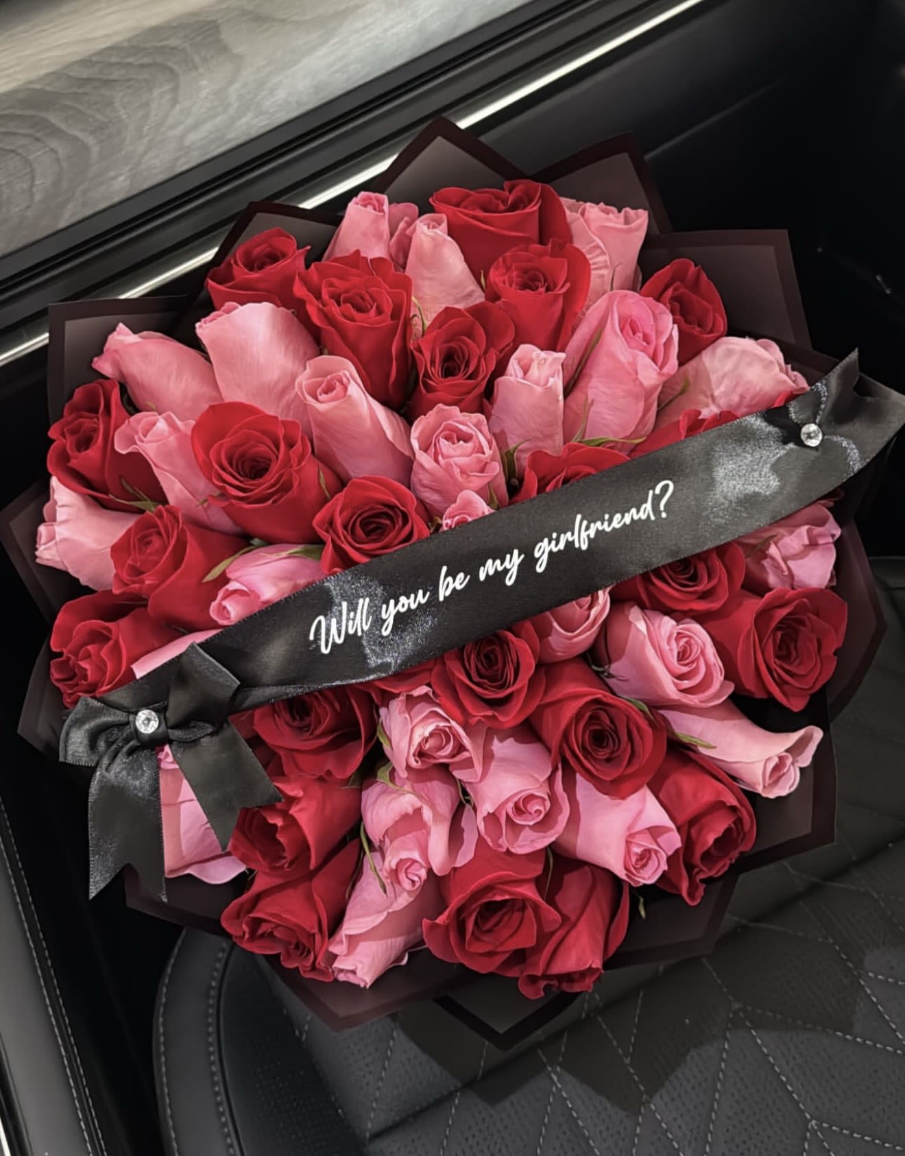 Be Mine Rose Proposal Bouquet - Make the moment unforgettable with our Be Mine Rose Proposal Bouquet. This stunning arrangement blends premium red and pink roses, presented with an elegant ribbon that asks the sweetest question: “Will you be my girlfriend?” A heart-melting gesture crafted for romantic surprises, anniversaries, or the start of something beautiful.  Perfect for creating a memory they’ll cherish forever.
