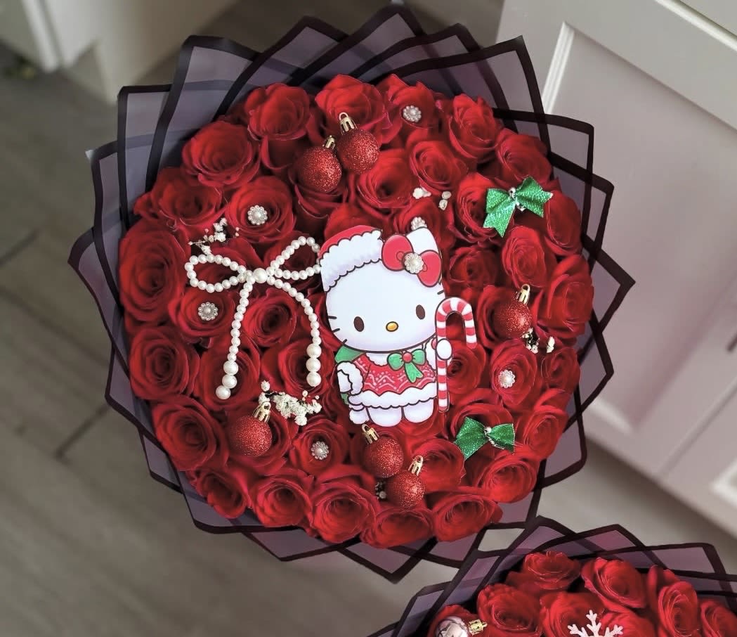 Christmas Hello Kitty Bouquet - Bring extra holiday magic to your celebrations with our Christmas Hello Kitty Bouquet. This festive arrangement features rich seasonal florals paired with an adorable Hello Kitty cut-out, making it the perfect blend of cute and Christmas charm. A joyful, heart-melting gift for the season—ideal for surprising a loved one, decorating your home, or adding a playful touch to any holiday moment. 