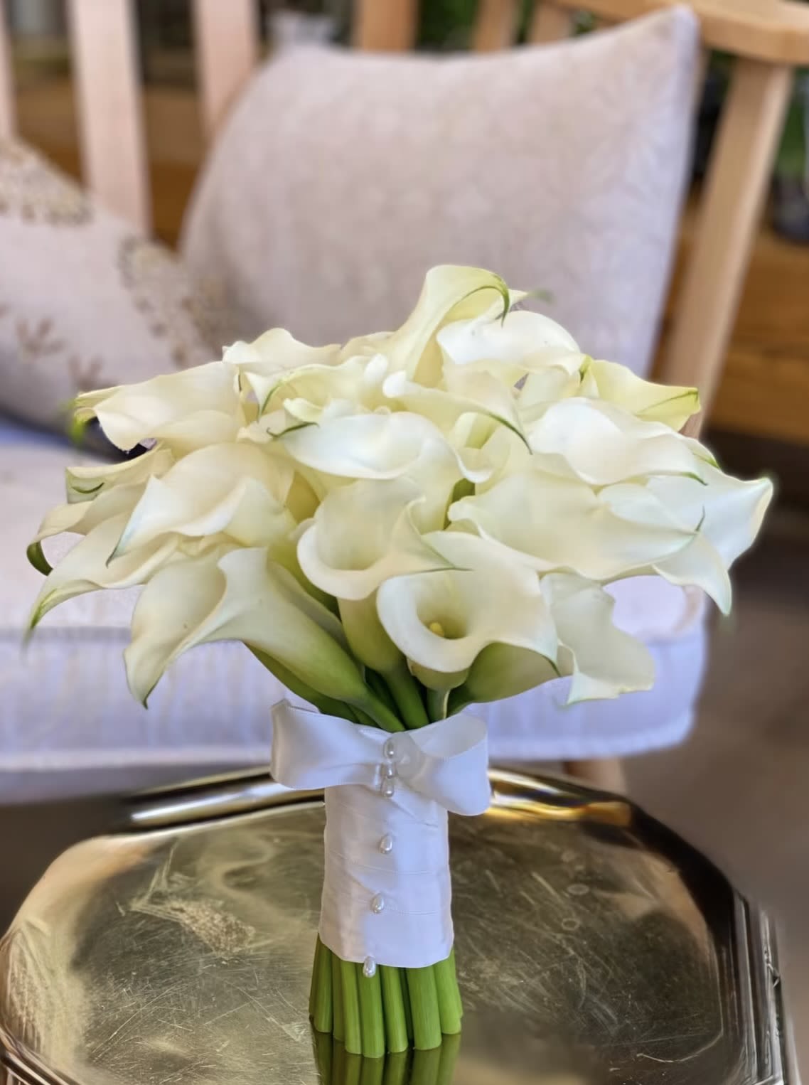 Calla Lilly Bridal  - Pure White  Calla Lilies wrapped in your choice of double satin ribbon. Pure Luxury for a classic Bride. 