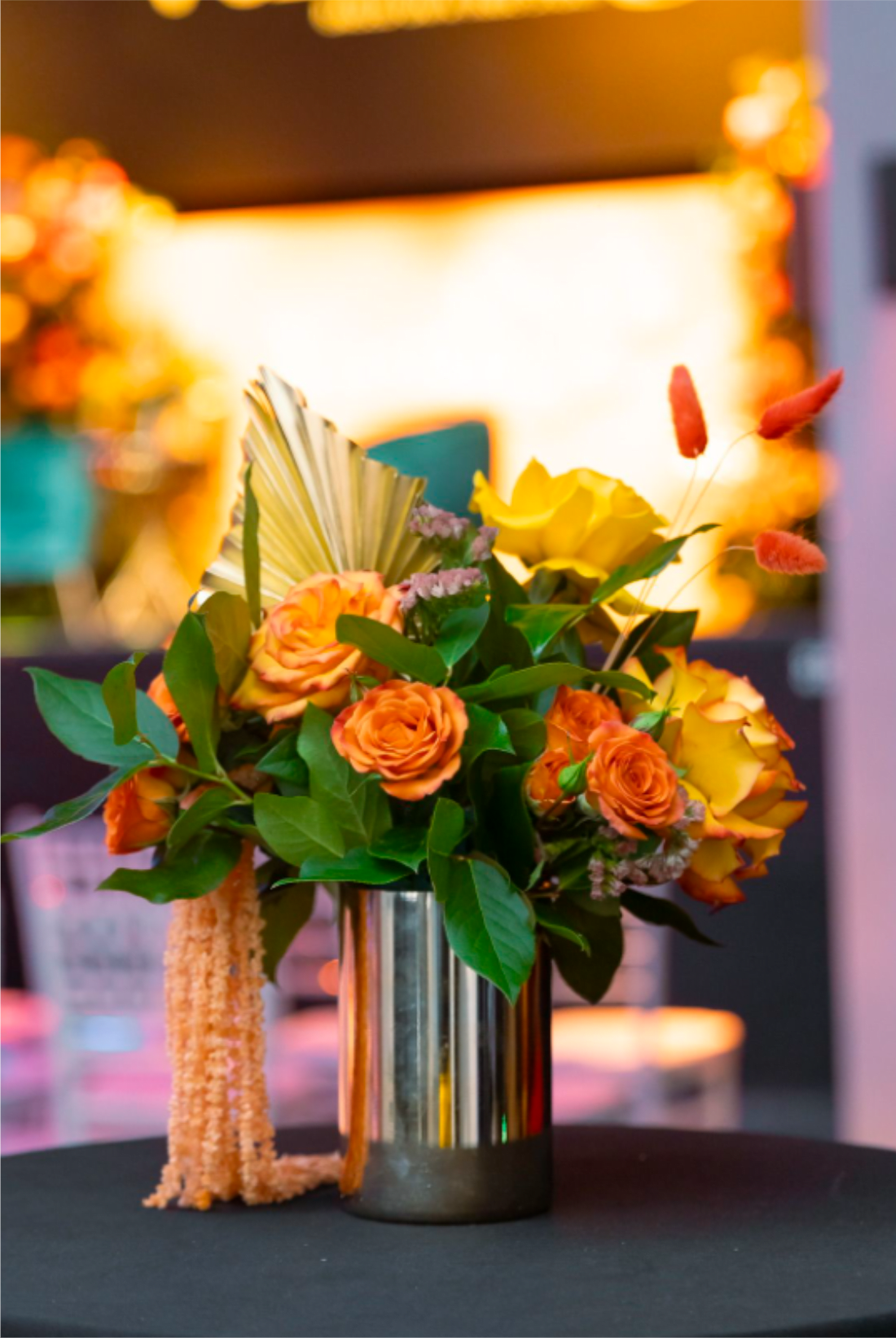 Thanksgiving Harvest Trio - CBring the spirit of the season to your celebration with our Thanksgiving Harvest Trio, a beautifully coordinated set of three centerpieces designed to elevate your holiday table décor. Each arrangement features a warm blend of autumn blooms, textured foliage, and seasonal accents that create a rich, inviting ambiance.  Crafted with premium flowers—such as roses, mums, sunflowers, and fall greenery—this trio offers perfect harmony for long tables, buffet setups, or multiple display areas throughout your home or event.   Customizable Colors: Prefer a different color palette? The trio can be tailored to match your theme, ensuring a seamless and personalized look.