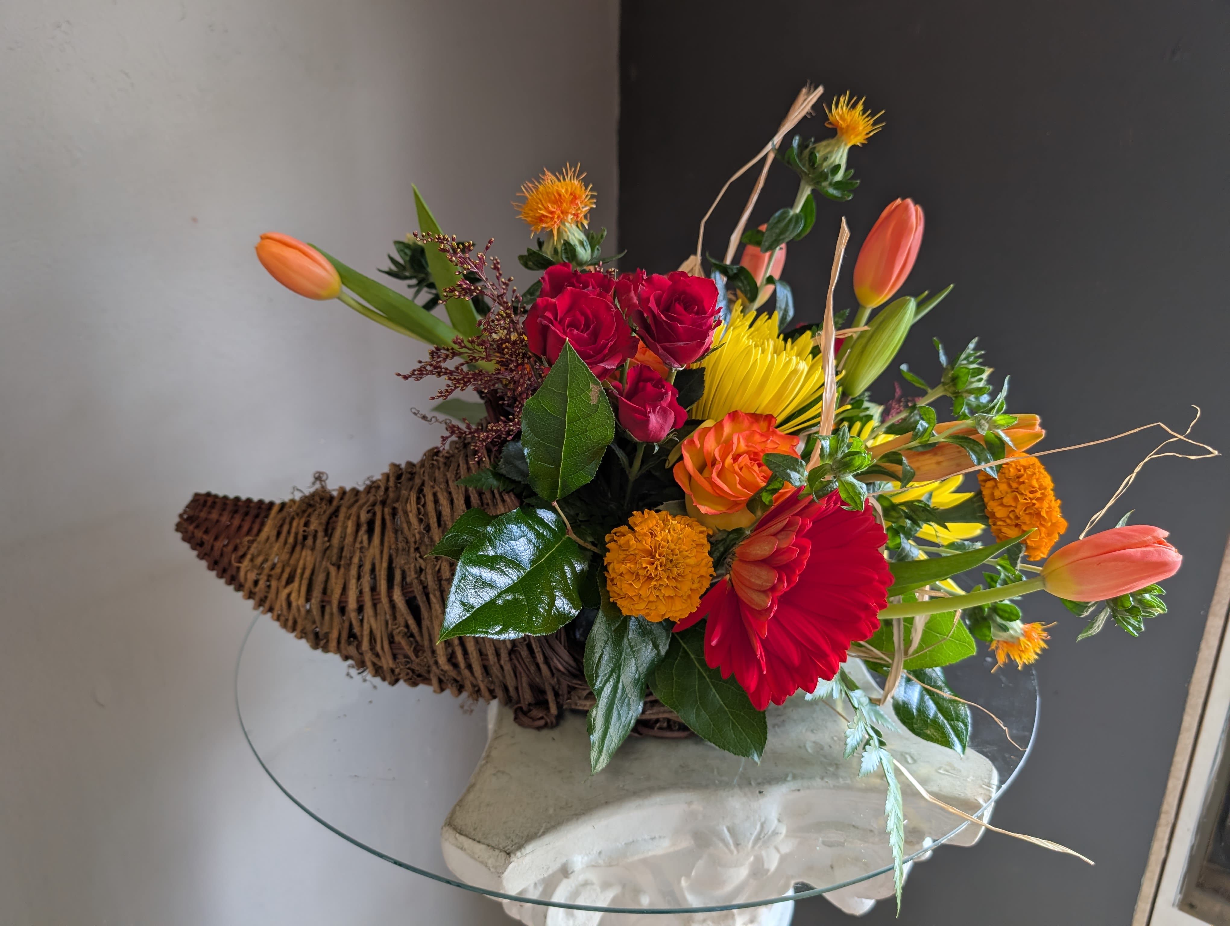 Holiday Centerpiece Table of 4 - Beautiful arrangement of fresh flowers displayed inside a cornocopia 