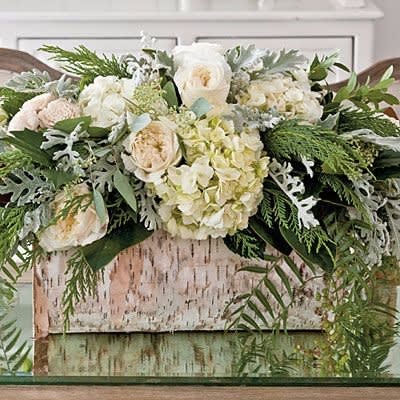 Winter Birch in Bloom - Birch container filled with Christmas greens, hydrangea, and white Eskimo roses