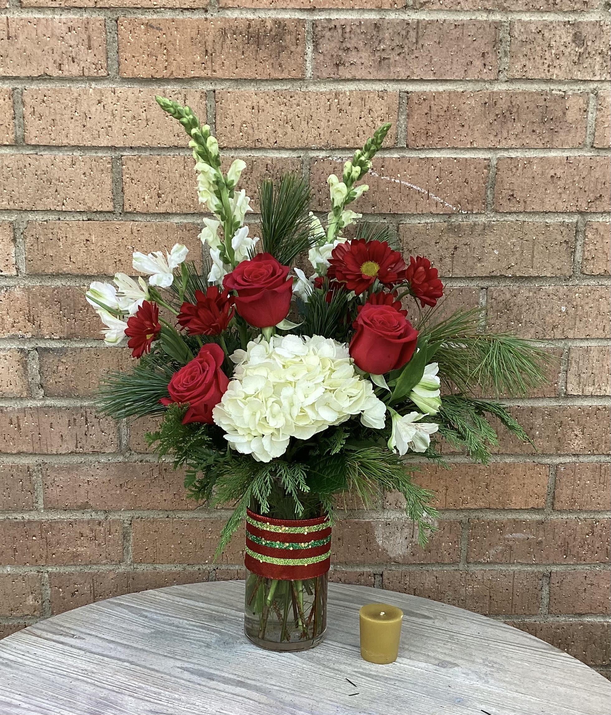 Happy Holidays  - This vase arrangement will bring the feel and smells of Christmas into any home or office.. filled with assorted Christmas greens