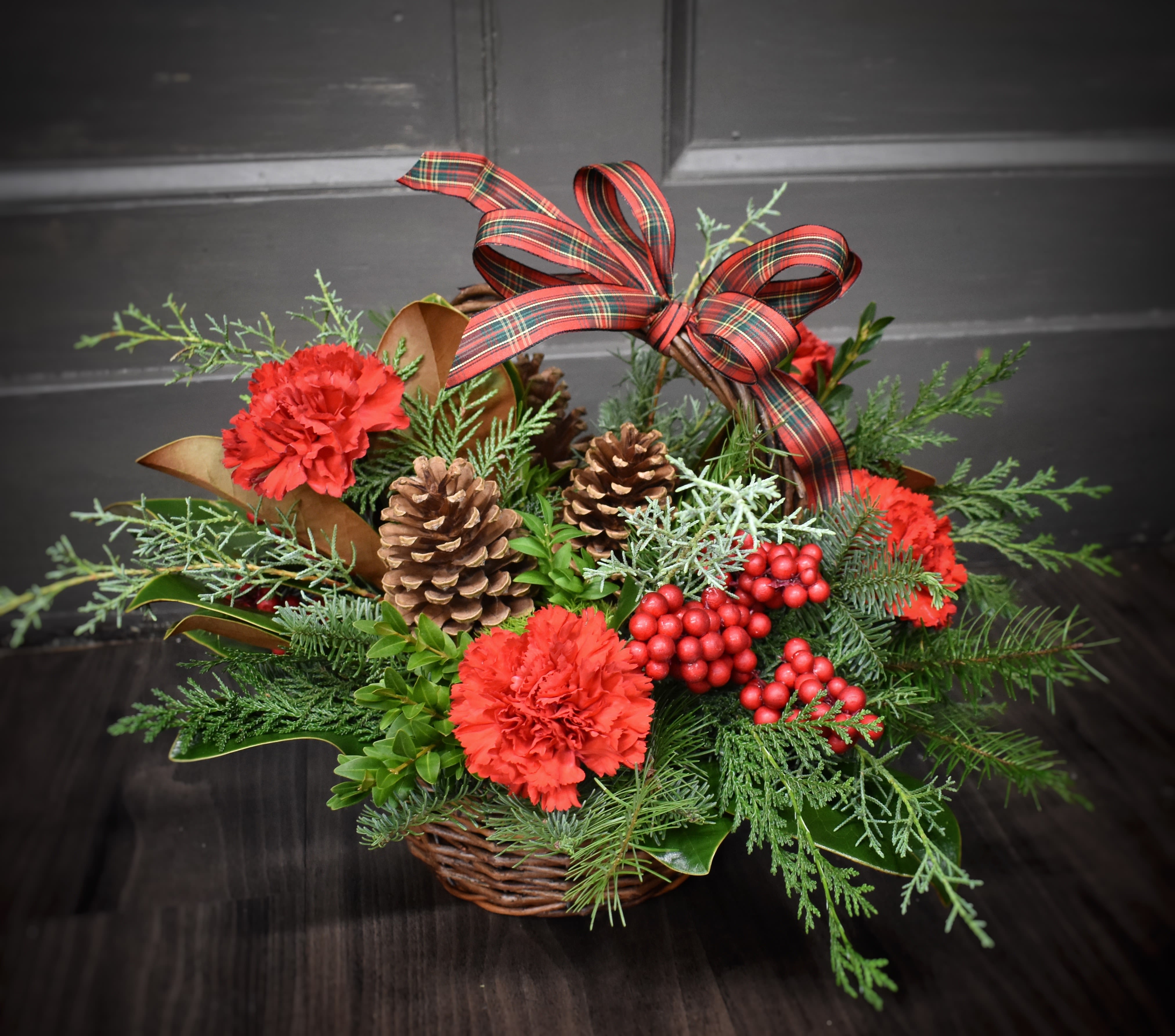 Basket of Christmas Cheer - Available for Local St. Cloud, MN Delivery Only - A tisket a tasket, a basket of christmas cheer! Includes evergreen, winterberry and carnations