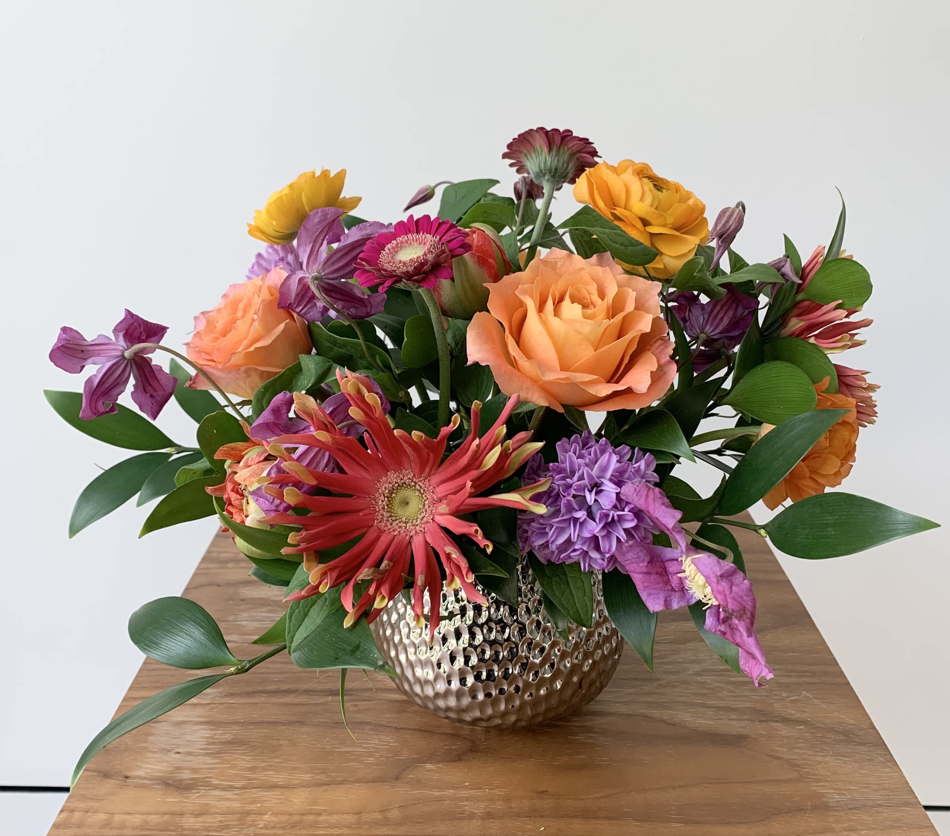 Delightful - Cute colorful flower arrangement of premium flowers in a silver Supernova Pot vase for any occasion your celebrate. Even small arrangements are meaningful and Michaela loves making those. You can upgrade for bigger sizes. The choice of flowers may vary, but rest assured Michaela carefully selects a lovely happy mix of blooms.