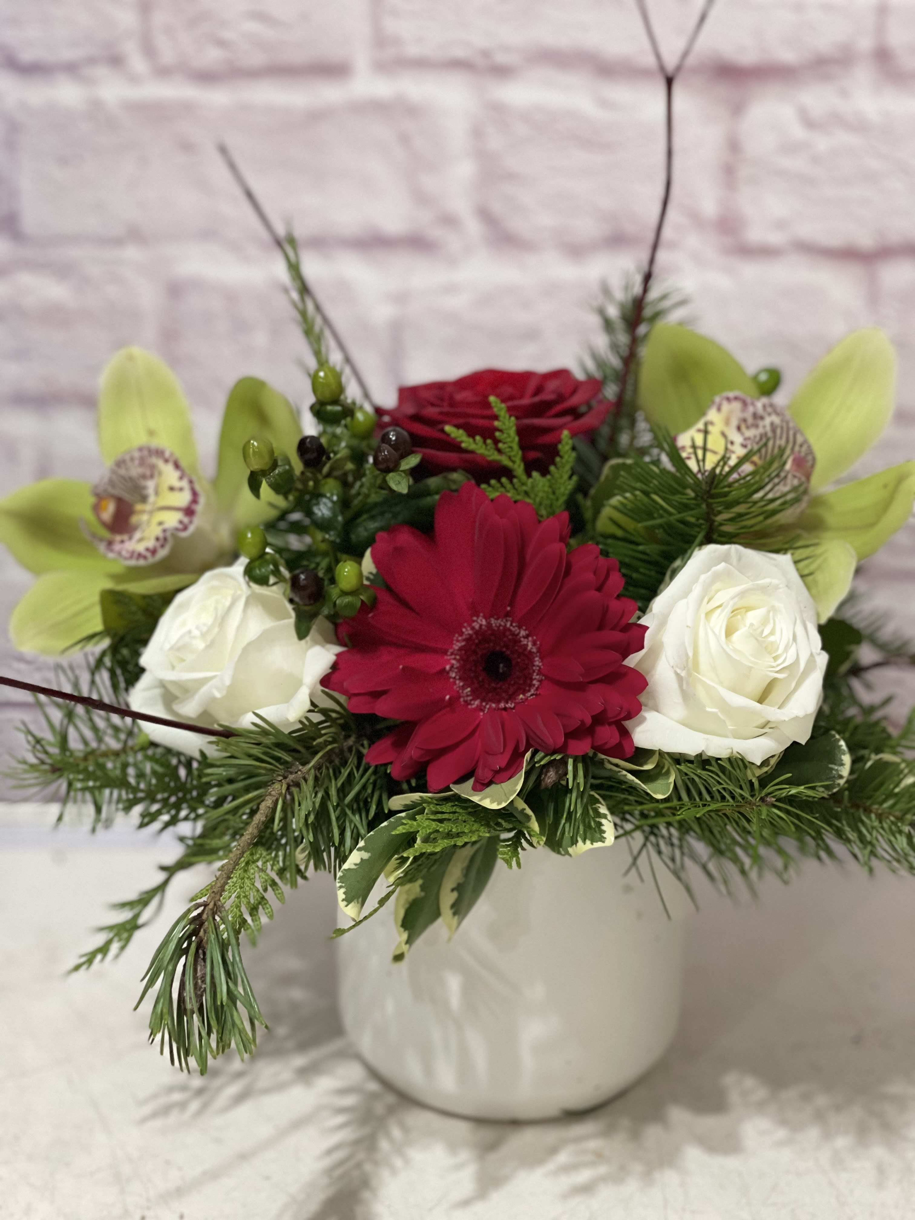 Holiday Bliss  - Red, white and green blooms in a white ceramic container. 
