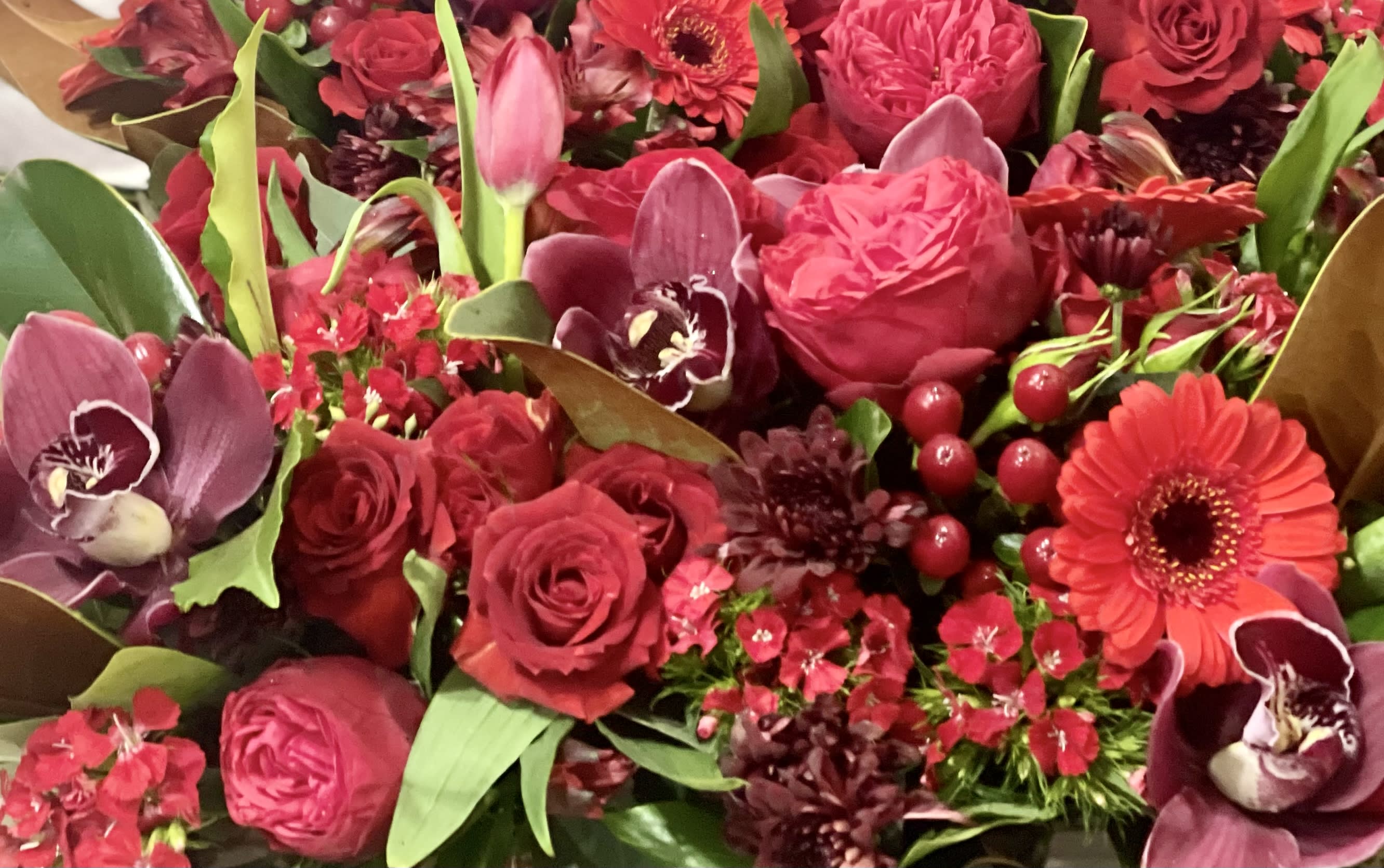 Small - Red Designer’s Choice  - A mix of designer’s choice. Premium red flowers in a vase.   Perfect flowers for birthdays, congratulations, romantic gestures, and &quot;Thank you.&quot; Also a beautiful wedding palette.  Available for delivery in Seattle, Bellevue, Shoreline, and surrounding areas. Available for delivery in all neighborhoods in Seattle including Magnolia, Ballard, Fremont, Downtown, Queen Anne, Crown Hill, U District, West Seattle, International District, Capitol Hill, Pioneer Square, Beacon Hill, Columbia City, Georgetown, etc. 