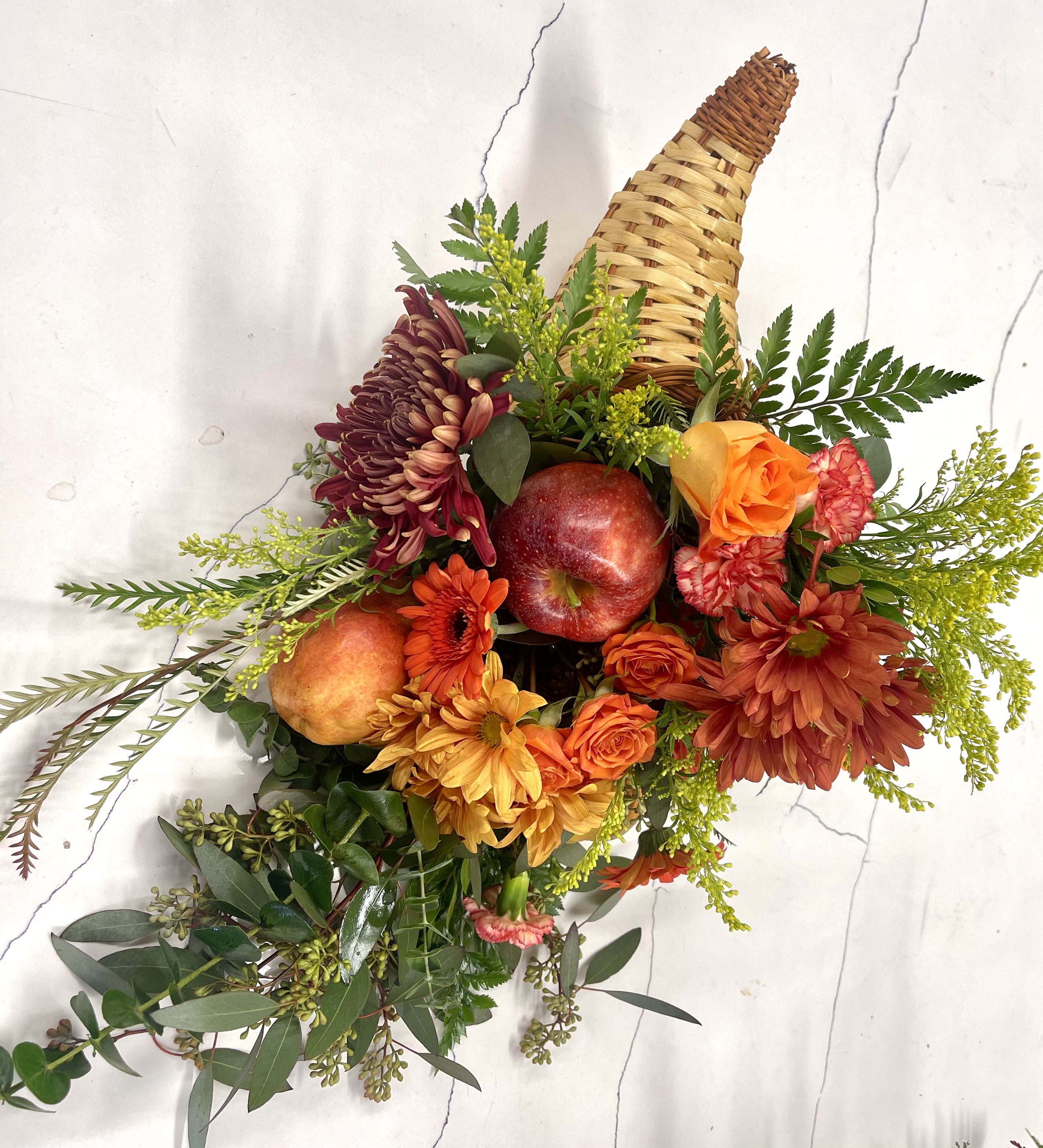 Fruits of the harvest - Add a new tradition to your Thanksgiving celebration with our cornucopia fruit and blooms baskets.