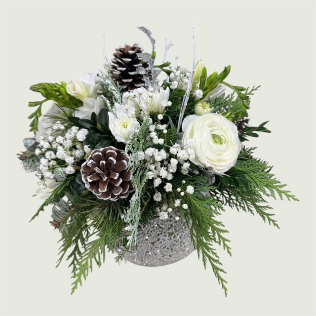 Snowy Blossoms - All White Flowers, Mixed Christmas Greens, and Pinecones with accents of silver Ruscus in a beautiful beaded bubble bowl.