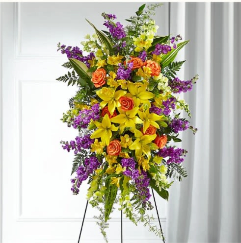 Thoughtful Prayers Standing Spray - Thoughtful Prayers Standing Spray Our Thoughtful Prayers Standing Spray beautifully remembers their passion and radiance within each bright bloom. Bold lilies, roses, stock and snapdragons are paired with lush greens to celebrate the life of a loved one. This grand standing spray is hand delivered by a local florist and is best suited to send to a service or funeral home.