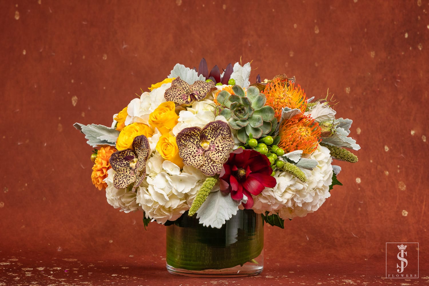 Harvest Bloom - The crisp natural colors of Autumn are brought together to create a lovely bouquet for any fall enthusiast. The stunning combination of white hydrangea, yellow roses, succulent , protea, and more creates a truly unique arrangement.