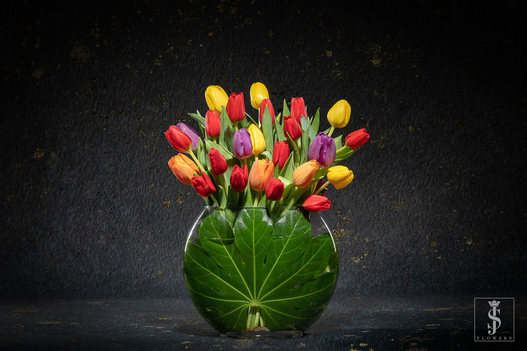 I love Tulips - Modern Tulips - Nothing saying I love you with our Modern Arranged Tulips! Bring light and happiness to the love of your life with our Mix of tulips. This famous native of the Netherlands is a symbol of love between partners or family members. They also represent prosperity and are the flower associated with the eleventh wedding anniversary. Some say yellow flowers are the color of unrequited love. If you send someone a yellow tulip, you’re letting them know you love them even if they don’t share your feelings. Let in a little bit of that luminous love with JS Flowers.     