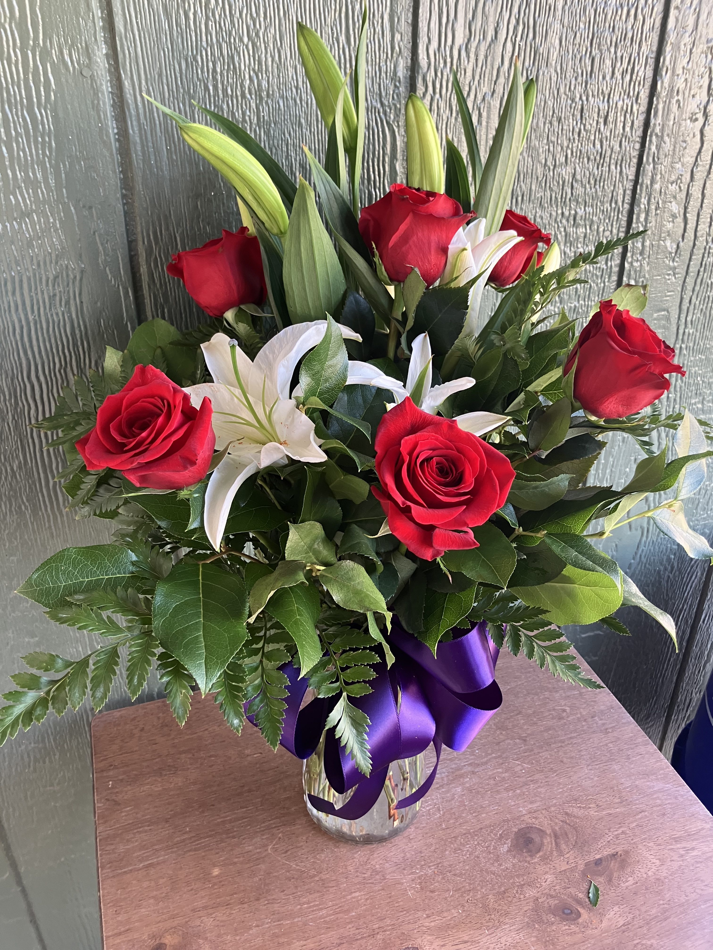 Half a Lily - Half dozen Roses with Lilies.