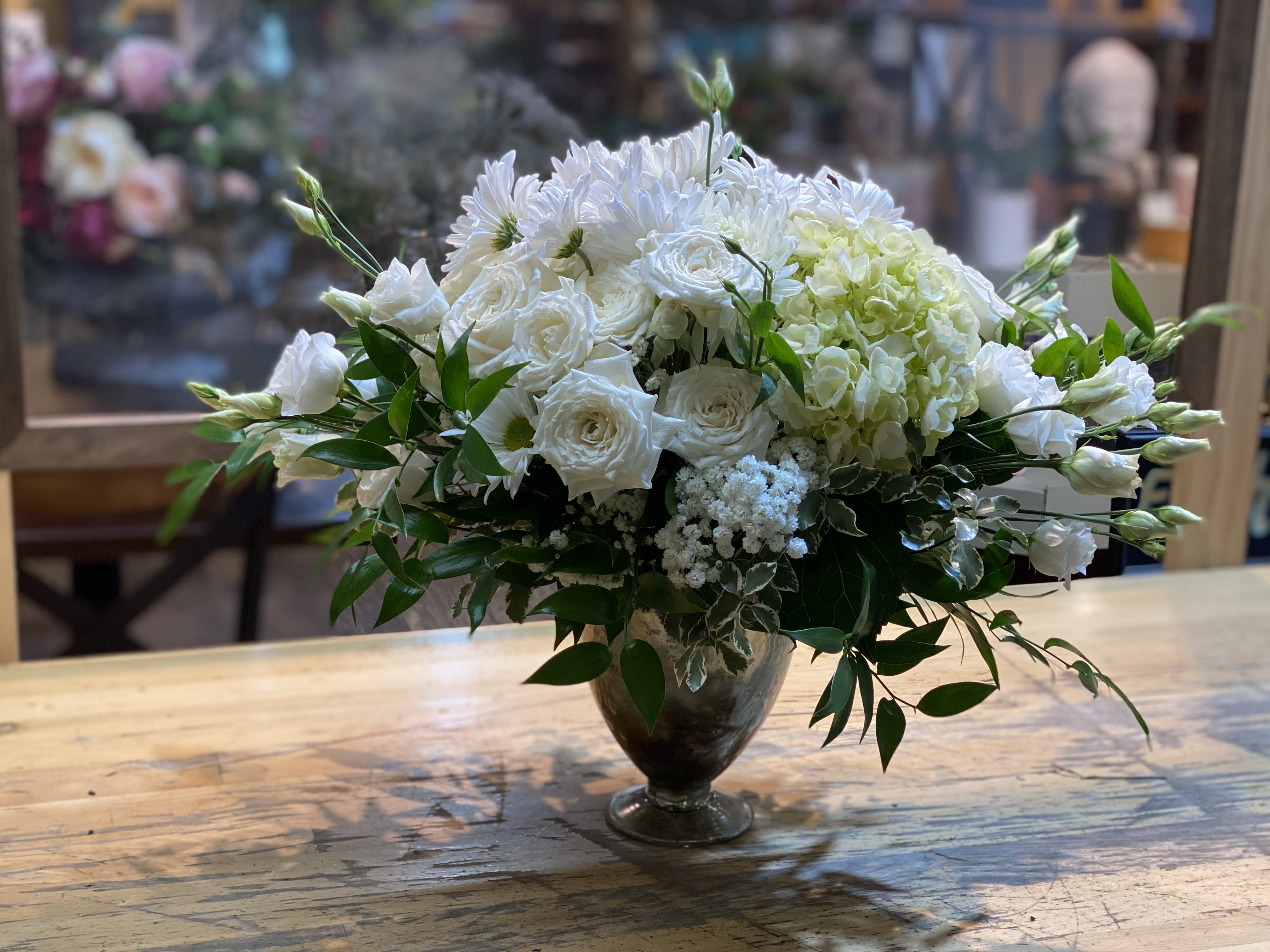 Imperial Glory - This dashing all-white bouquet of gorgeous lisianthus, hydrangea, spray rose, and daisy with a touch of green artfully arranged is the most gallant and classy gift for any occasion.   