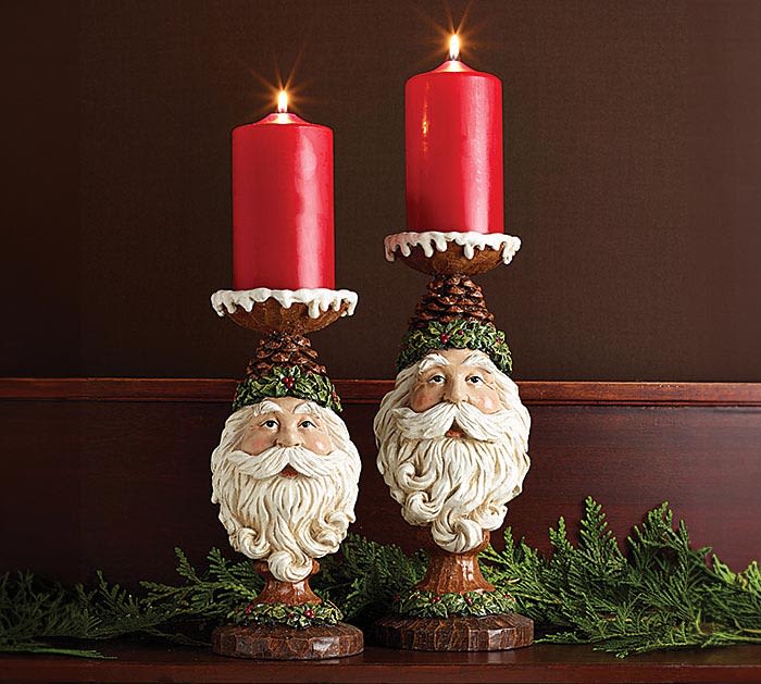 Santa Candleholder - ONLY ONE LEFT! - Hand-painted poly-resin pedestal candleholders in two heights. Old Fashion Santa face as the base with a pinecone hat trimmed in holly and snow covered candleholder on top. Both hold 3" candle.  ***LIMIT ONE, ONLY ONE LEFT IN STOCK***  Small: 10.75"H x 4.5"Diameter. Large: 12.5"H x 5"Diameter.