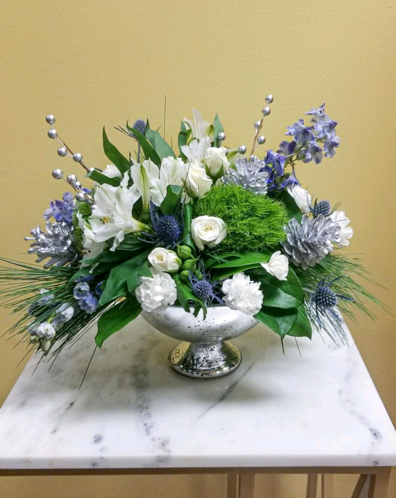 Hanukkah Sameach! - Beautifully designed mercury silver bowl with stunning blue accents. Inspired by winter’s cool blue &amp; white colors, our delightful arrangement delivers warm wishes to the people you love. 