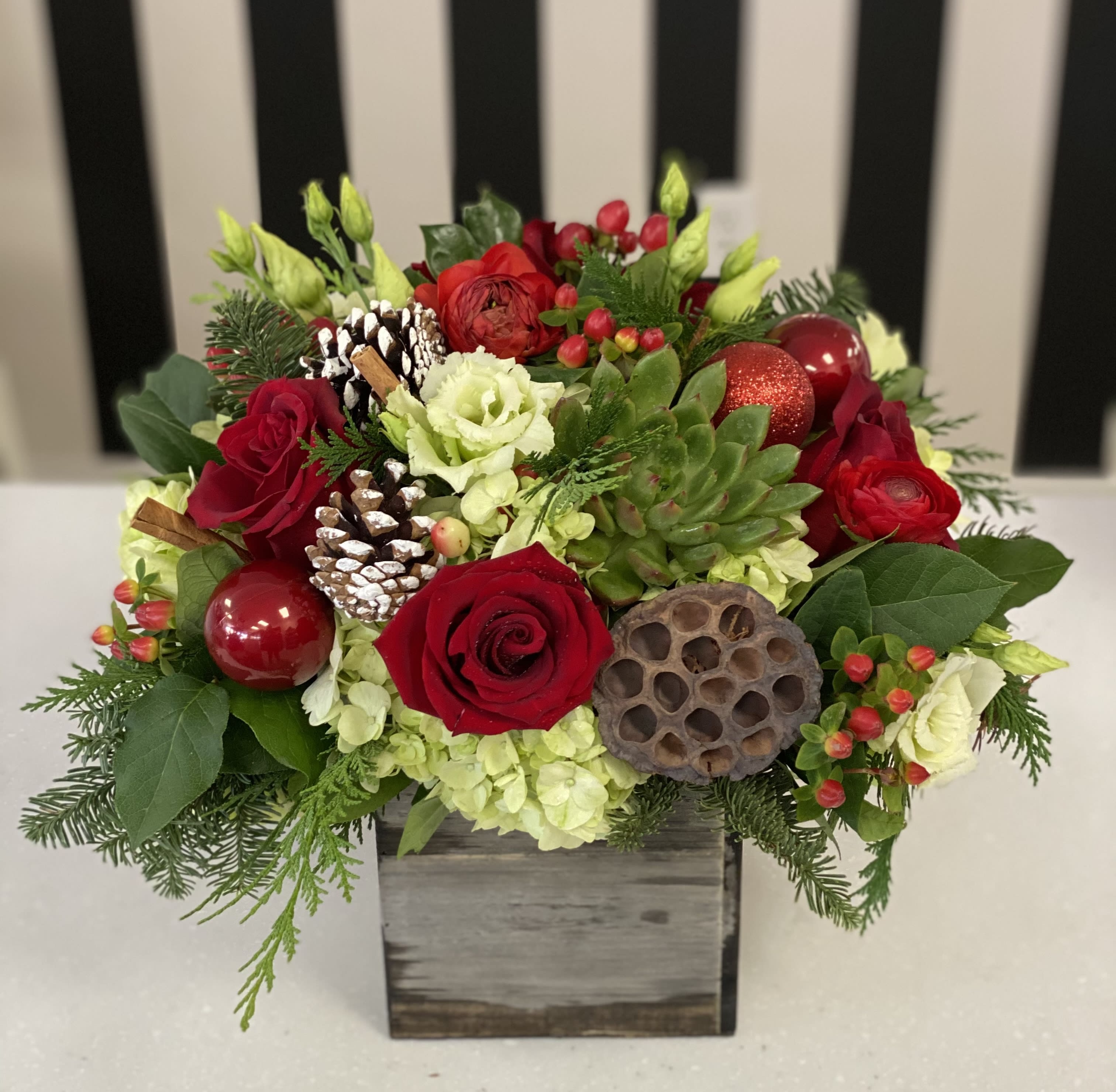 Christmas Cheer - Rustic box with Christmas Greens, hydrangea, roses, pinecones and ornaments.