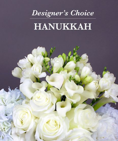Montclair Florist Designer's Choice - Hanukkah Mixed Arrangement - Can’t decide? How about a surprise! Florist’s Choice Daily Deal is a creative mix of seasonal blooms arranged with the designer’s freshest selection. You get a perfect arrangement every time.  Your arrangement will include the florist's choice of fresh flowers and it would come in either a short container, a medium, or tall vase, whichever is available at the time of ordering 