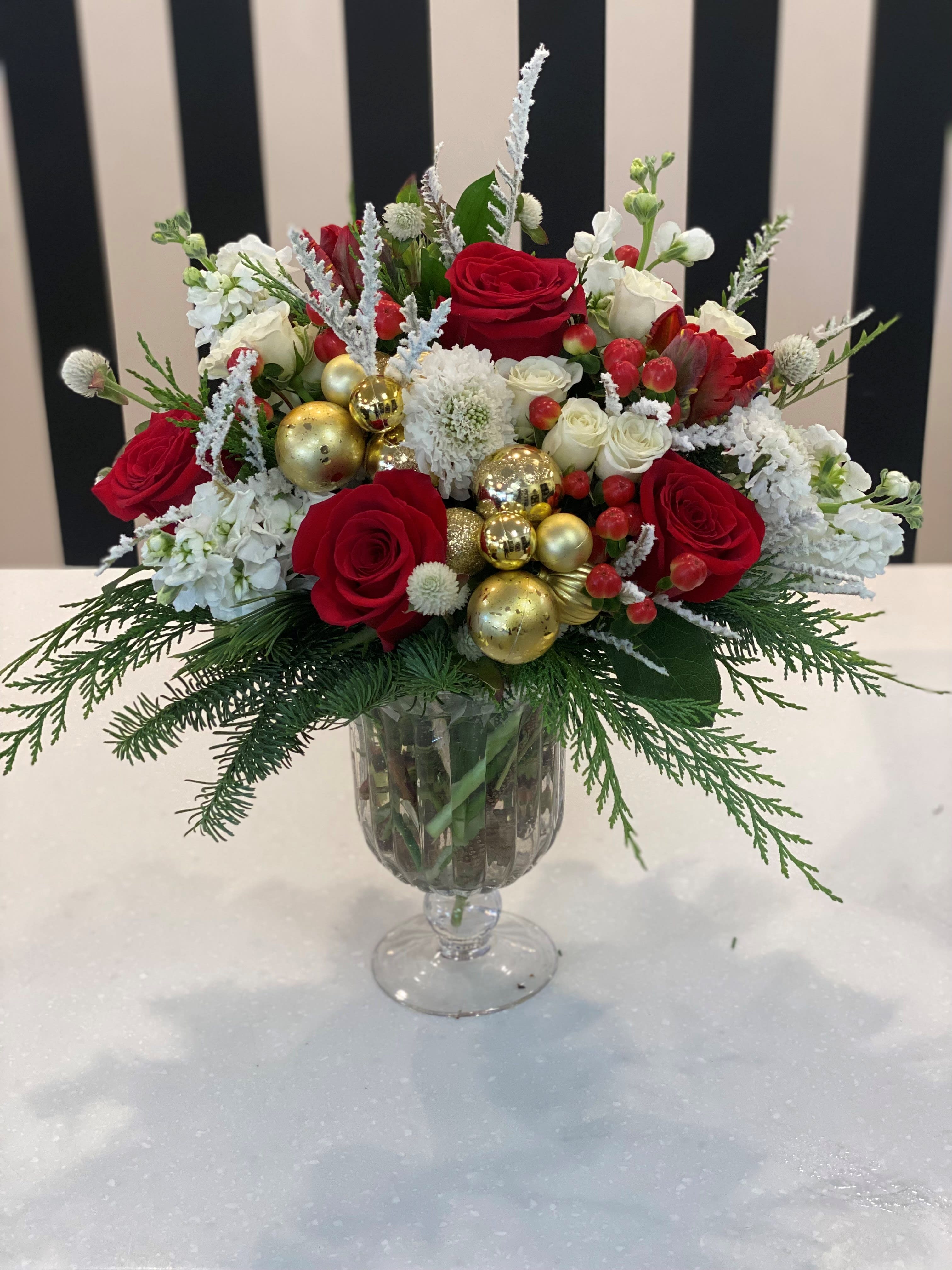Festive Christmas - This Stunning arrangement includes a variety of red and white premium blooms, with decorative ornaments.