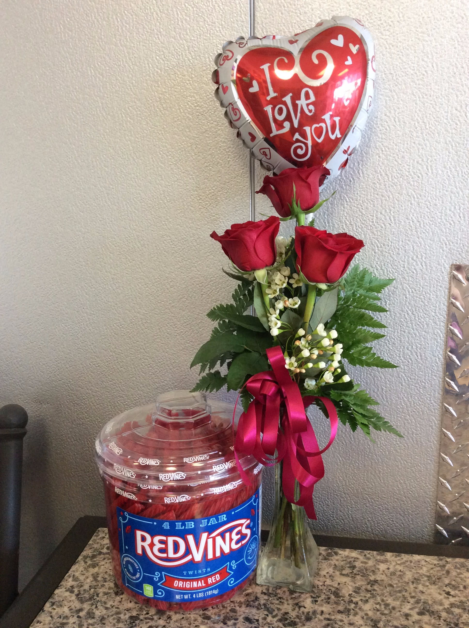 Roses, Mylar &amp; Vines - 3 red roses arranged in glass vase, I love you mylar balloon &amp; 4 Pound tub of Red Vines - Approx. Height 20&quot;