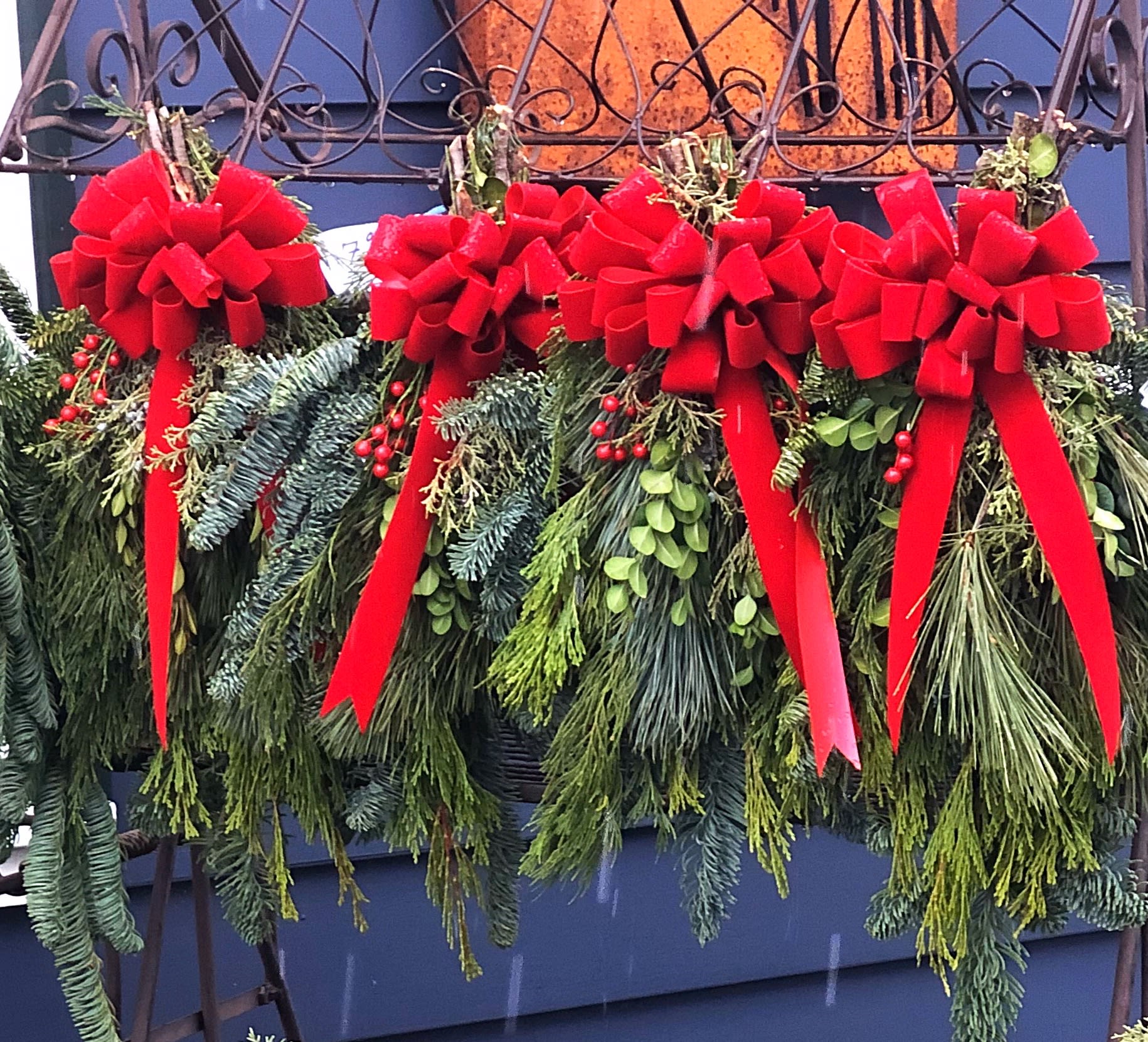 Door Swags with Bow - Our mixed evergreen door swags are always trimmed with a real hand made bow.  Approx. 22&quot; in length. Other custom sizes and decorating available.  **Please specify bow color in notes when ordering, otherwise it will be traditional red.** ***Pre-order only, product availability the first week of December.***