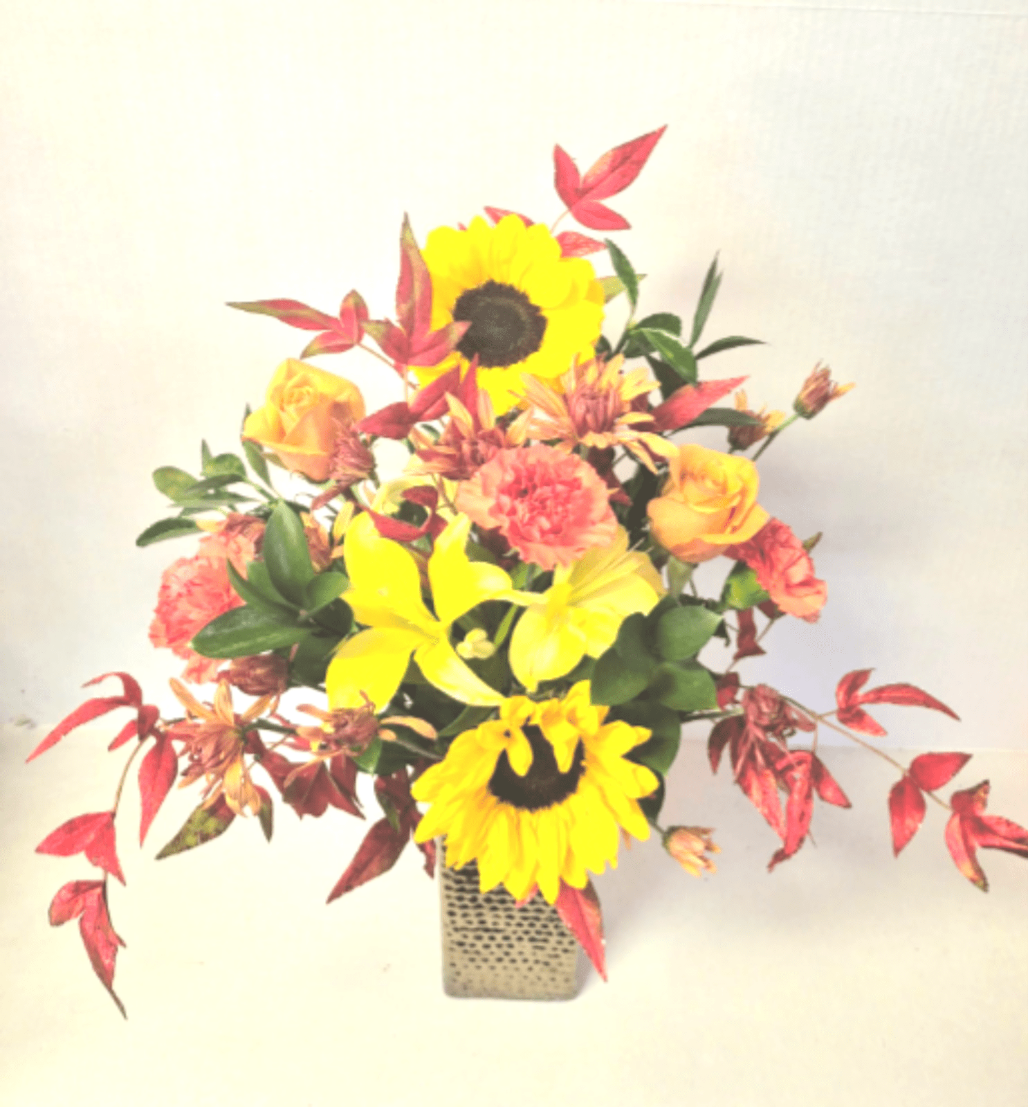Autumn Flair Vase - A beautiful bronze colored vase filled with sunflowers,roses,carnations and lilies with glittering fall leaf accents.