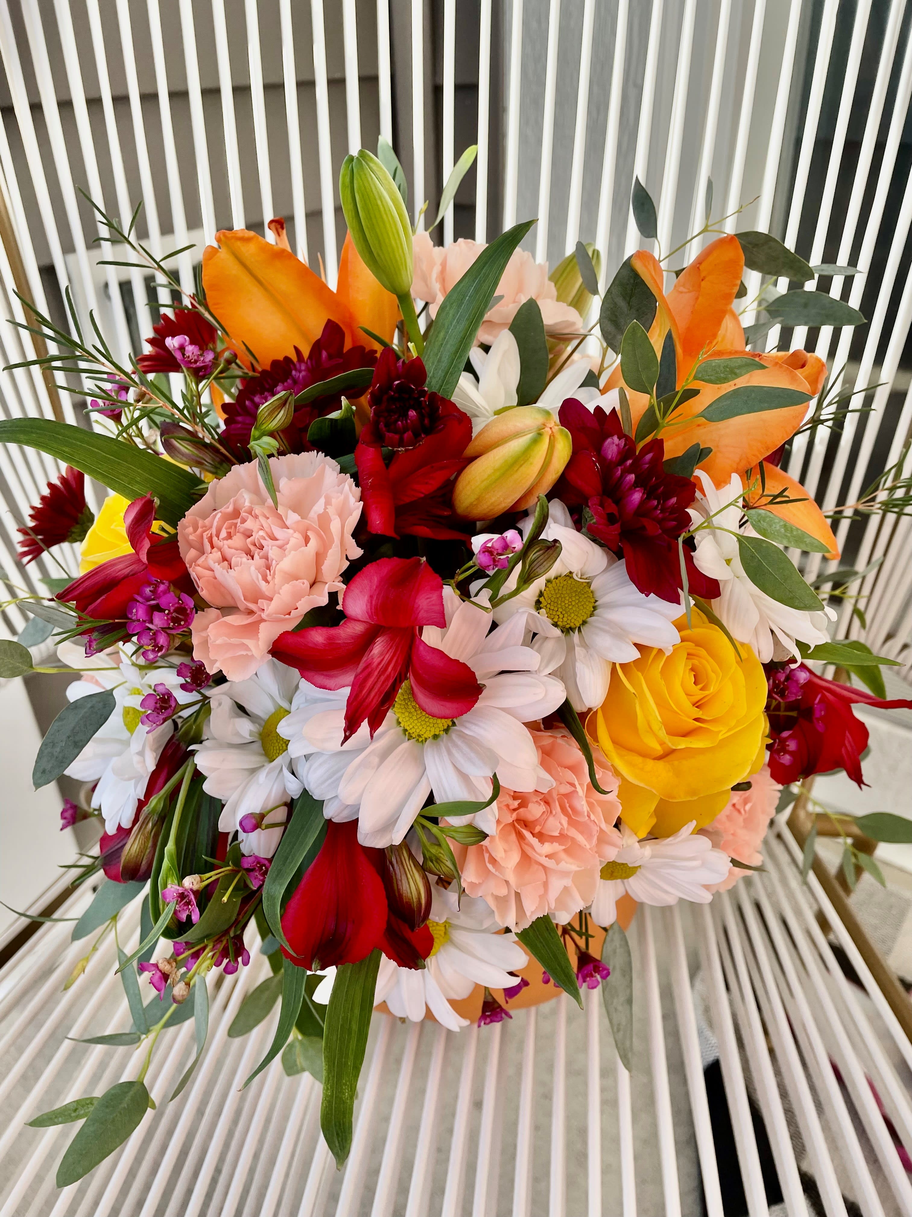Fall Pumpkin - A gorgeous Fall bouquet arranged in a cute pumpkin vase.